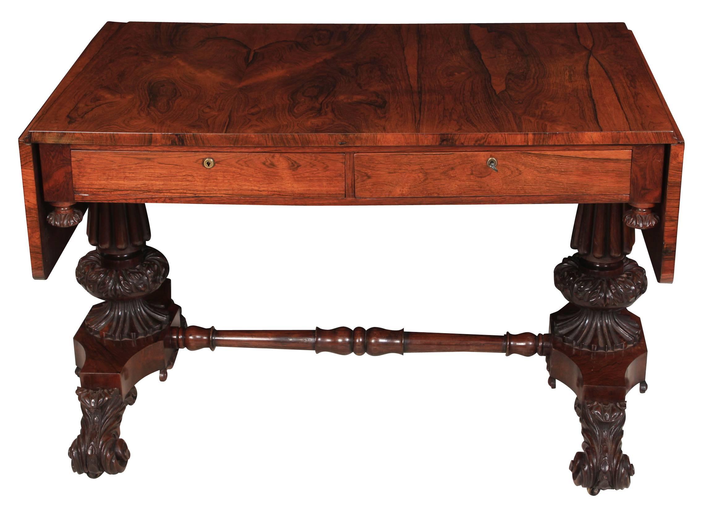 English, circa 1820.
This William IV sofa table is in superb condition, the drop leaf rosewood top boasts a wonderful grain and color.
There are two drawers on either side of the table, of solid oak and mahogany dovetailed construction and with