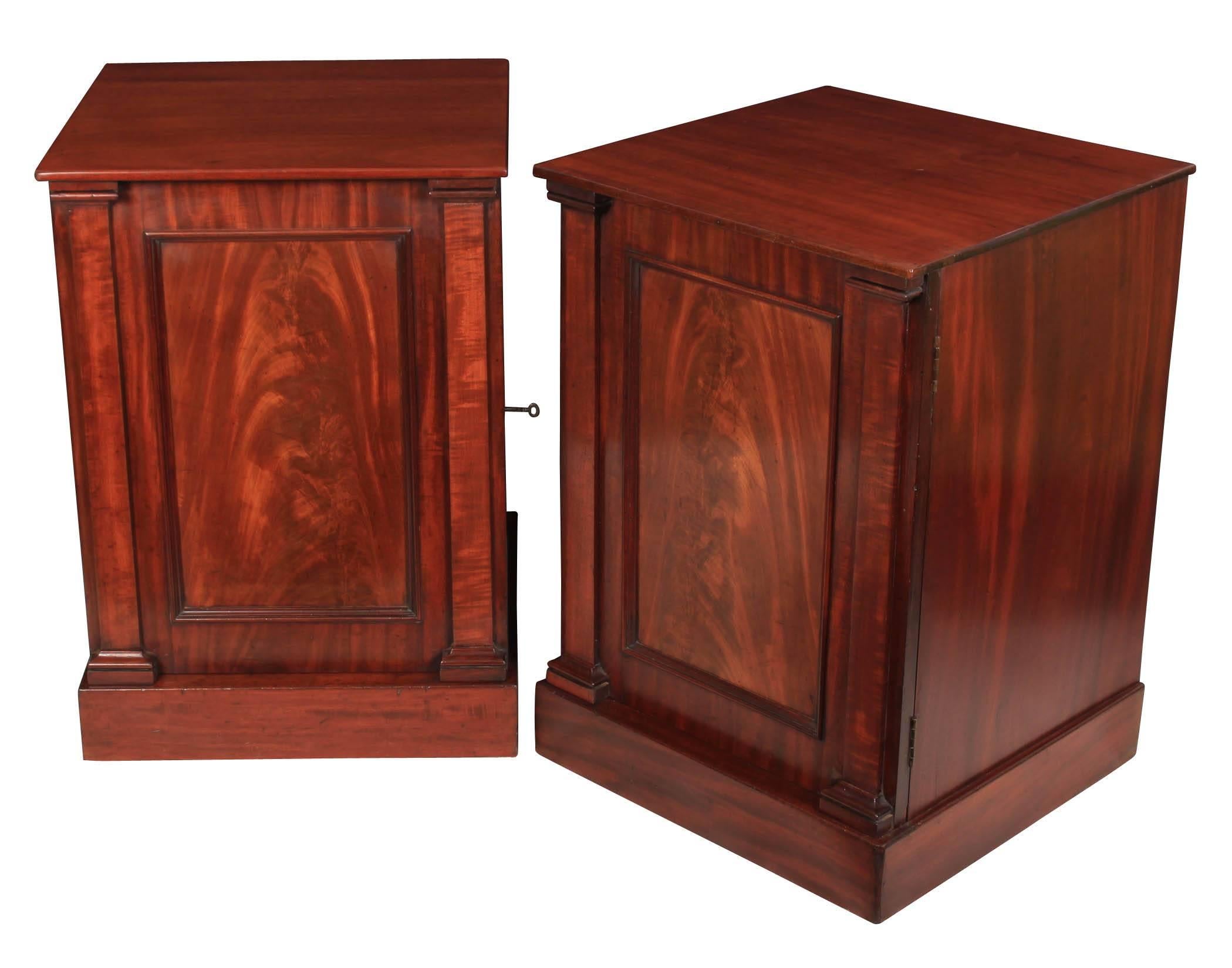 English, circa 1820.
These bedside cabinets are in showroom condition.
Solid mahogany tops over a single panelled door on each with flame mahogany fronts.
The doors open to reveal a single removable shelf.
On a plinth base.

Measure: W