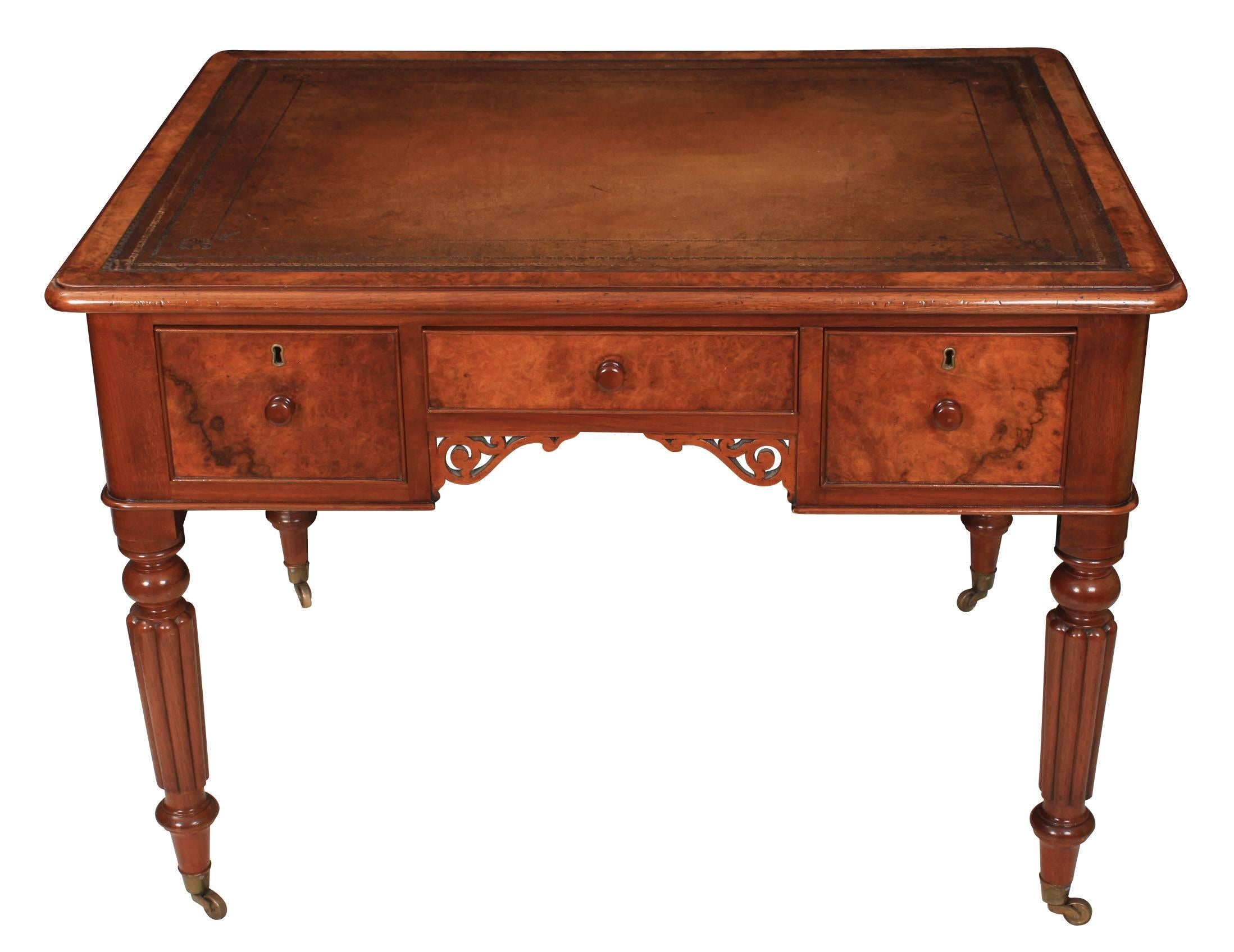 English, circa 1840.
This walnut writing table is in superb condition ready for the home or office.
Beautiful burr walnut top, with inset hand dyed tan leather writing surface, over three stationary drawers of solid mahogany dovetailed