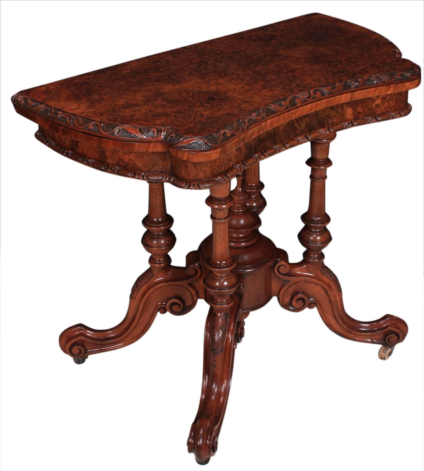 Irish, circa 1870.
This beautifully shaped burr walnut card table has crisp carving and is in showroom condition.
Swivel and fold over top which opens to reveal a green baise playing surface.
On four turned columns on four nicely carved scroll