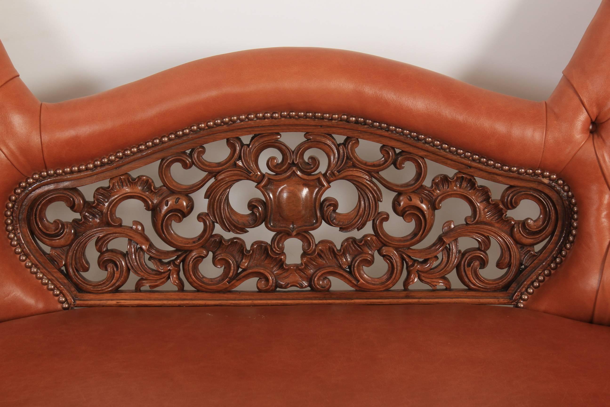 English Victorian Walnut and Leather Double Spoon Back Sofa For Sale