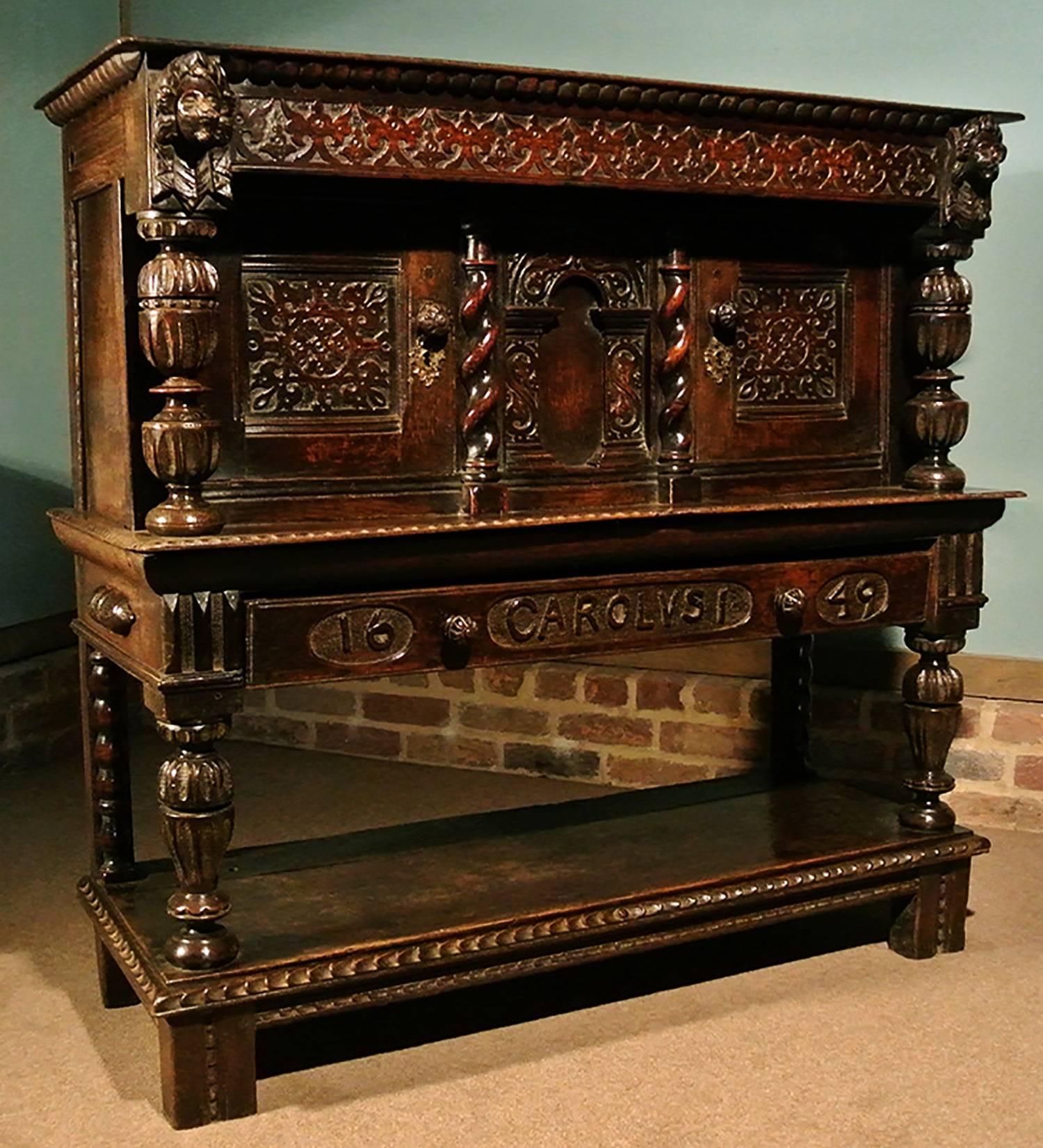 As rare as hens teeth! 

An exceptional joined oak livery cupboard dating from circa 1610. The drawer carved in 1649 in reverence to commemorate the beheading of Charles I (his name carved in the Latin, Carolus I, by a Royalist family hoping to