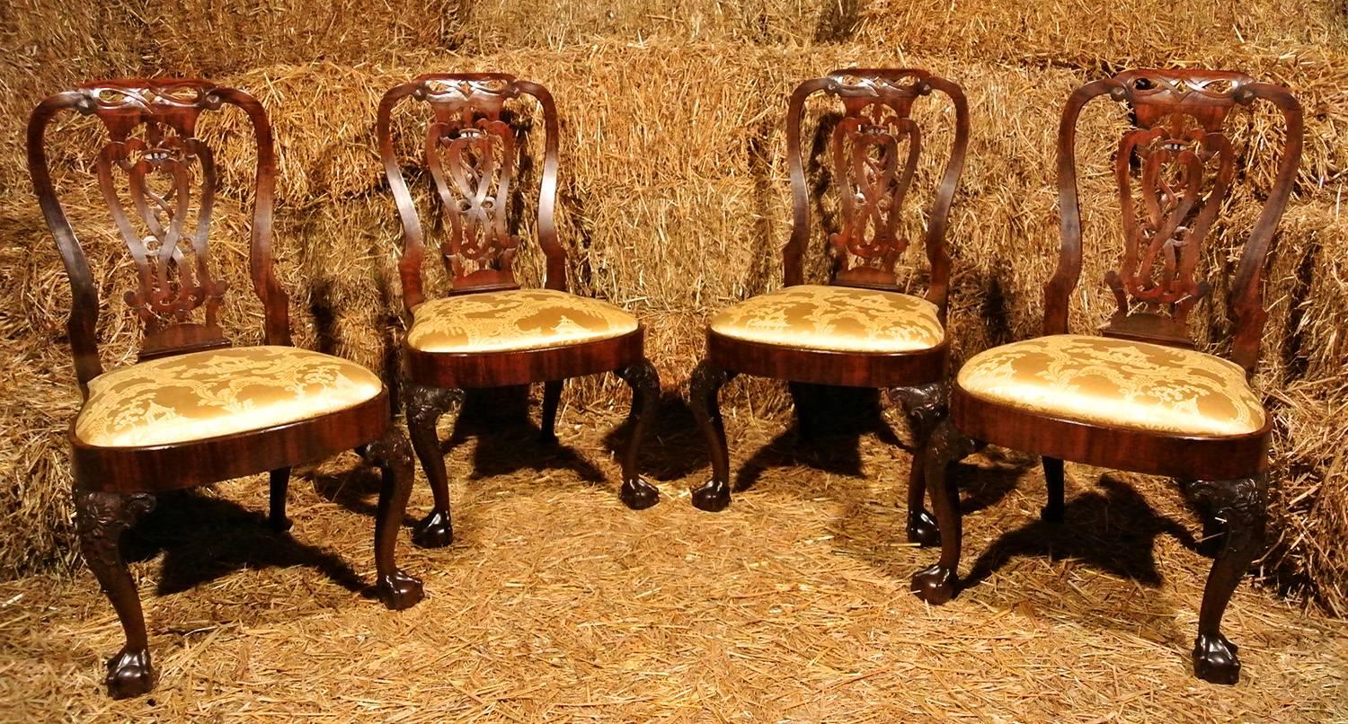 This magnificent set of Irish chairs date from 1755-1765, George III, and carry the Prince of Wales feathers. 

Of exceptionally fine workmanship and in exemplary original condition the design, construction method and finesse of the work indicates