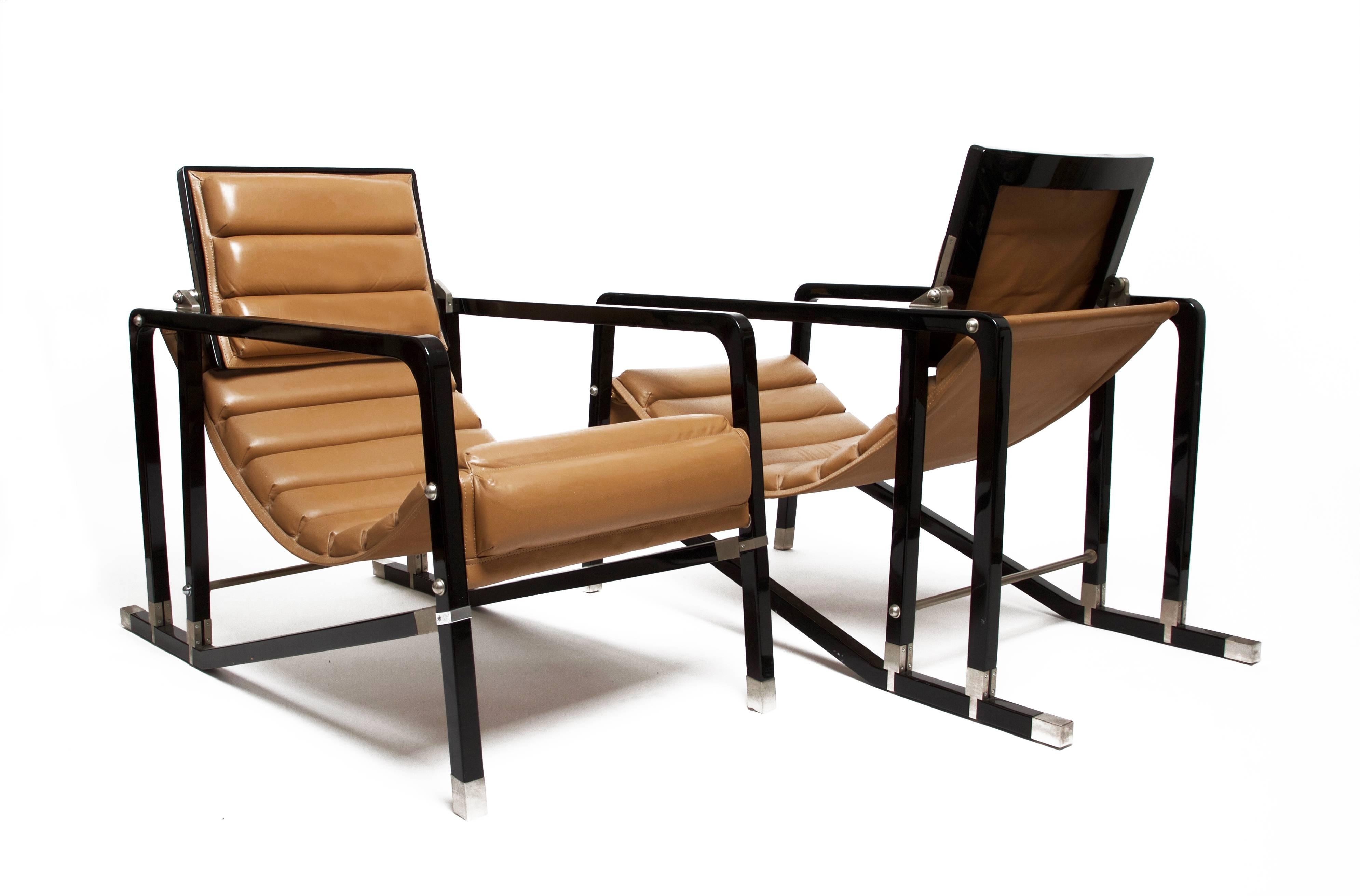 Eileen gray (1879-1976). 
Pair of "Transat" chairs. 
First edition by Andrée Putman for Ecart International, France, 1978. 
Black lacquered wood, brushed metal, leather. 
Excellent condition. 

Model designed by Eileen Gray in 1927