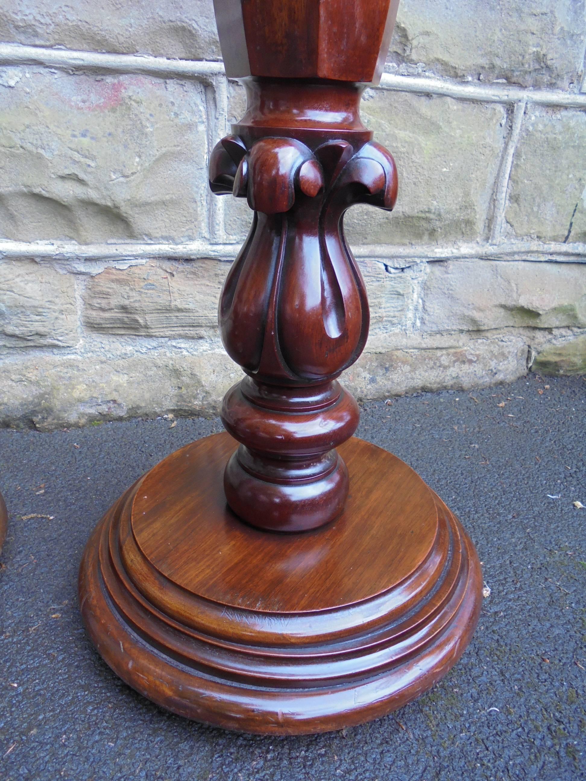 Offered for sale is this good pair of antique mahogany stands

Victorian in date, made from solid mahogany, circular tops, with a turned and faceted column, carved scrolling leaf base on circular stepped base with bun feet.

Offered in good