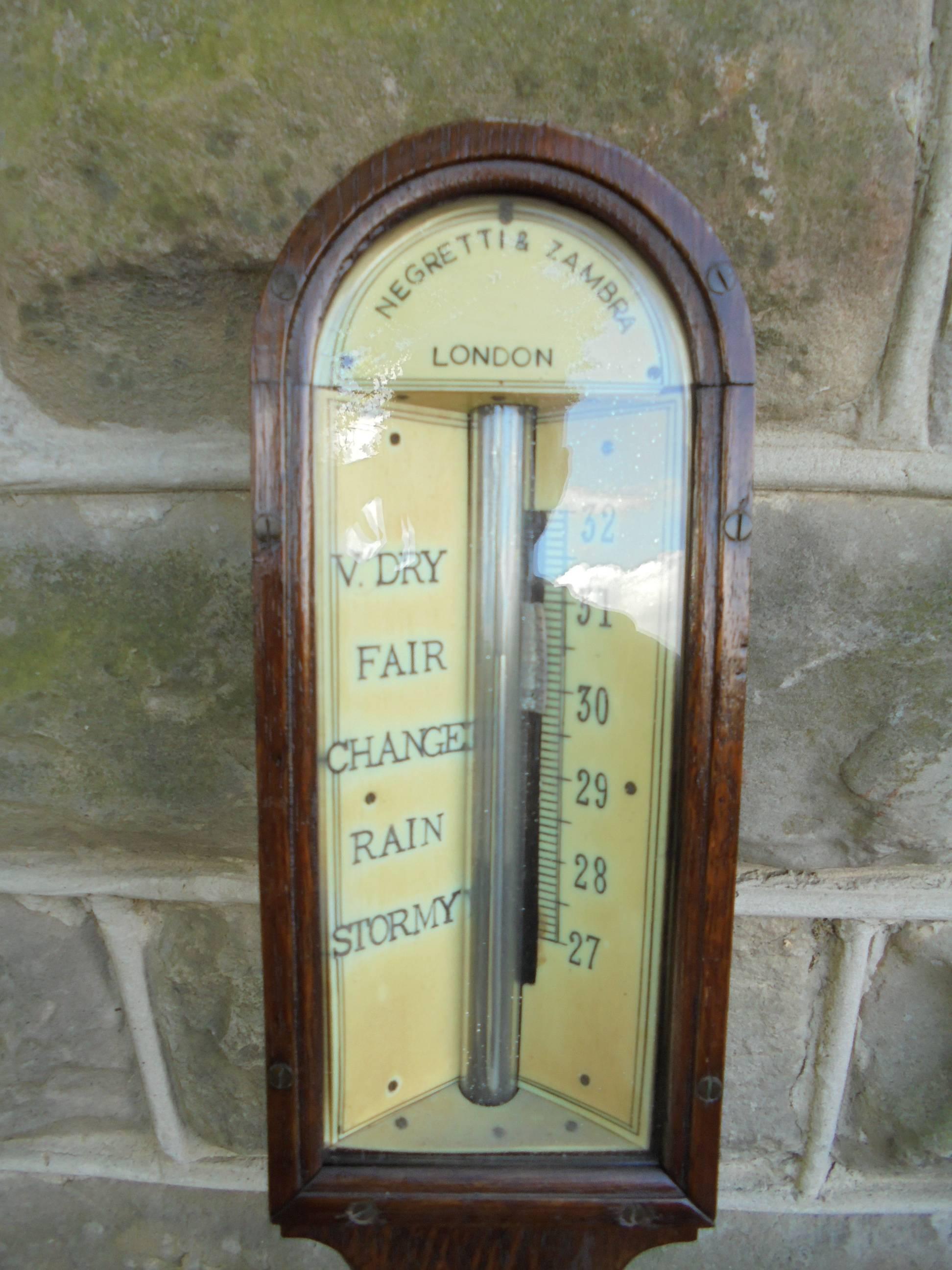 Offered for sale is this antique oak stick barometer.

Oak case with ivory dial signed Negretti and Zambra London. Cased ivory thermometer. Wooden knob scale turners. 

The oak case is in nice clean condition. Good working condition

Measures: