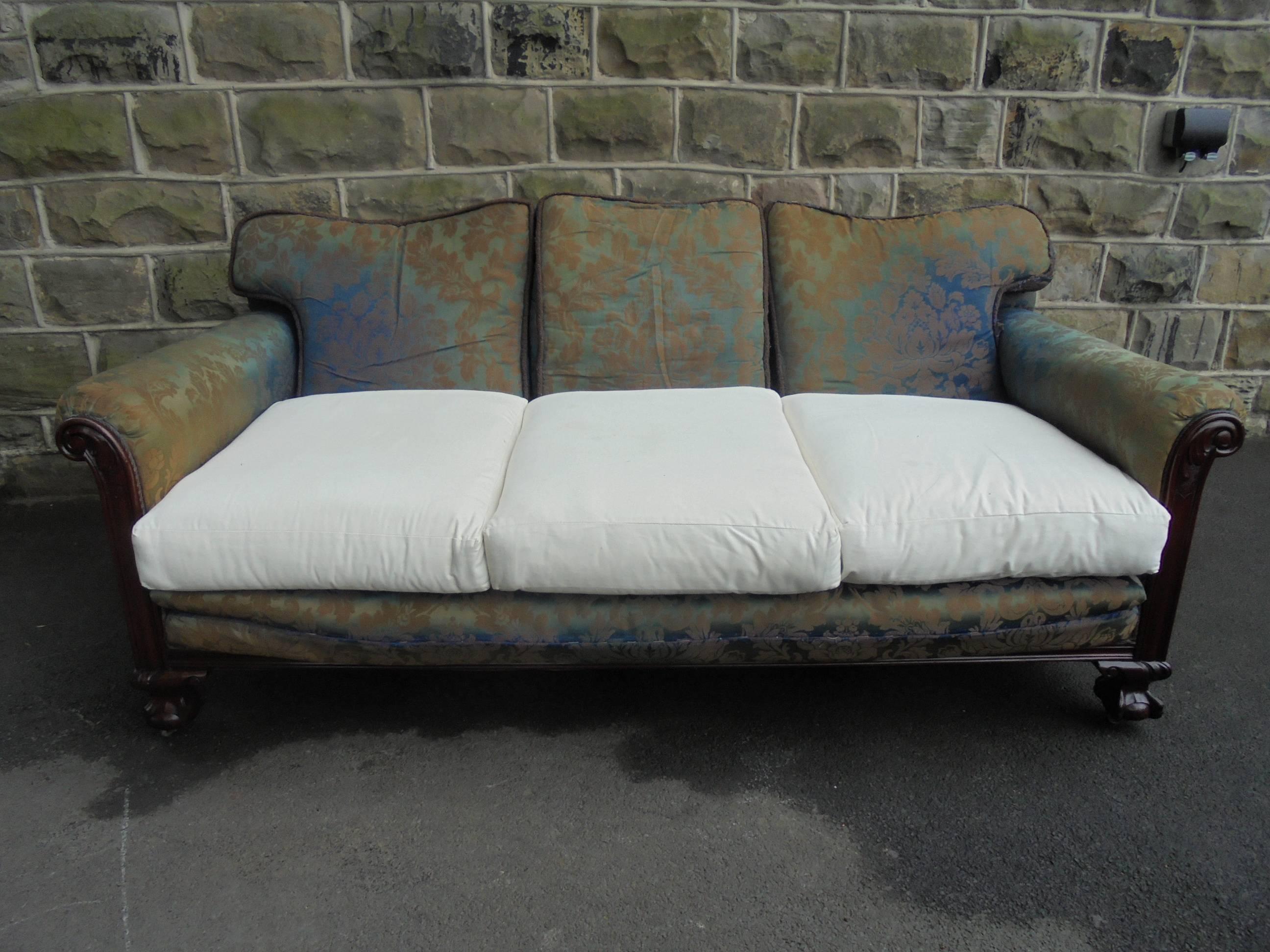 Offered for sale is this lovely shaped antique country house sofa. A very comfortable sofa. Great size and dimensions.

Covered in the original, chintz type fabric, the three-seat sofa has good deep seating area, having a wooden show wood frame