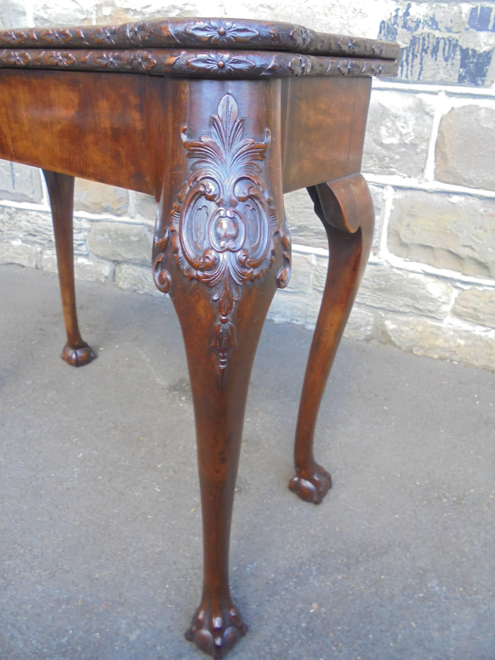 Offered for sale is this fine quality antique mahogany games table

In the Geo II style. Shaped fold over top with carved edge. Draw to the front. Standing on well carved cabriole legs with a claw and ball foot. It has a fold out gate legs action