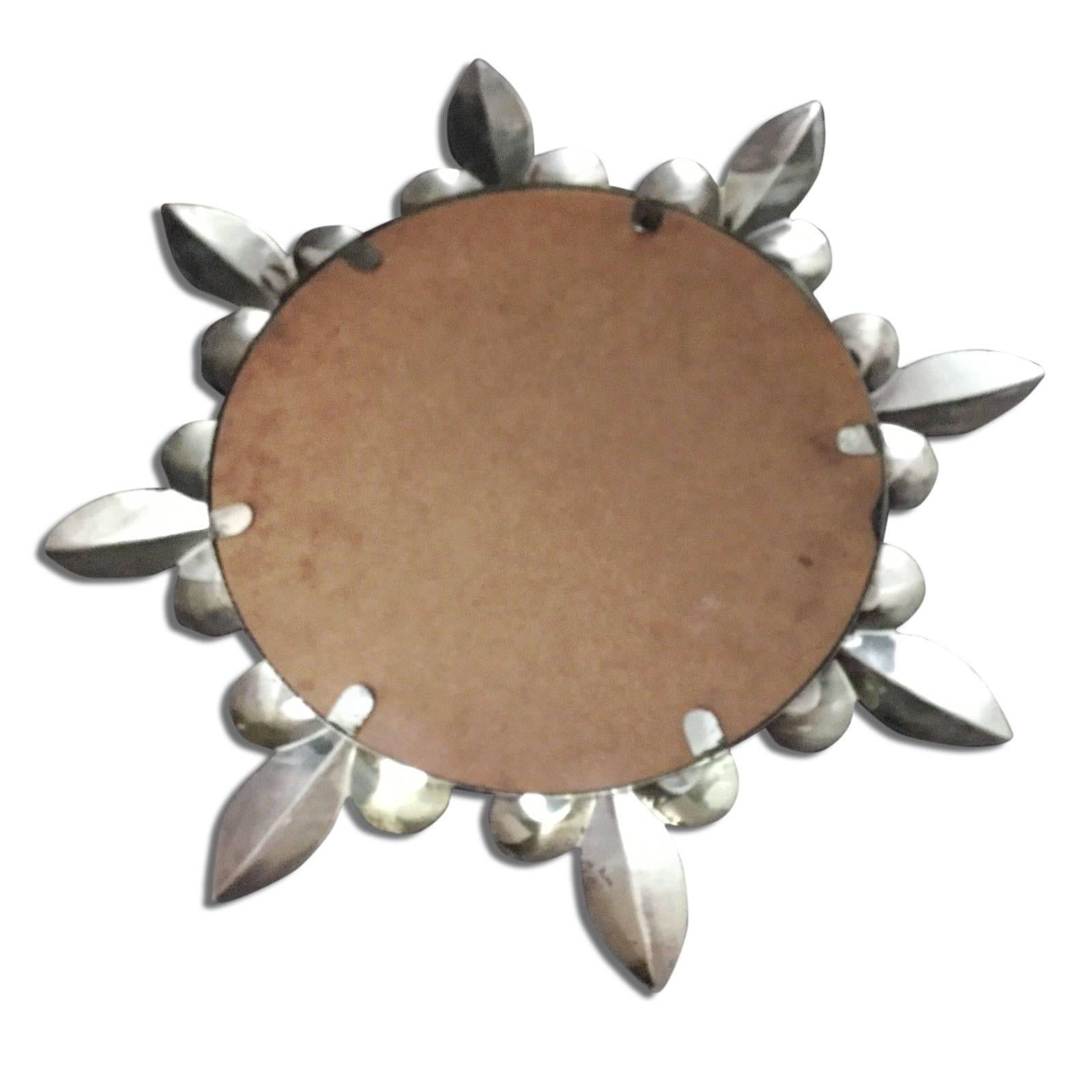 Stunning sunburst fleur-de-lys bronze wall mirror.
The mirror is in very good vintage condition with no damage nor tarnish.
Gorgeous mirror with a vintage glamour feel to it. This mirror is a focal point in any room, with its iconic starburst