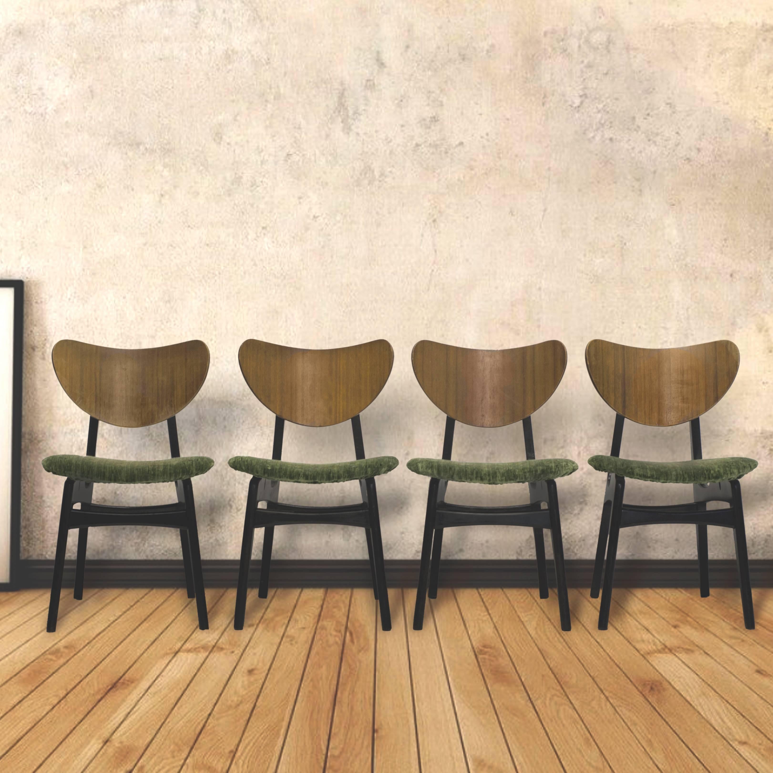 Four 1950s G plan butterfly dining chairs made from solid teak with original ebonised finish to the frames with tola butterfly backs.

Each seat has been lovingly re-upholstered in a beautiful green Sanderson textured velvet fabric.

Designed in