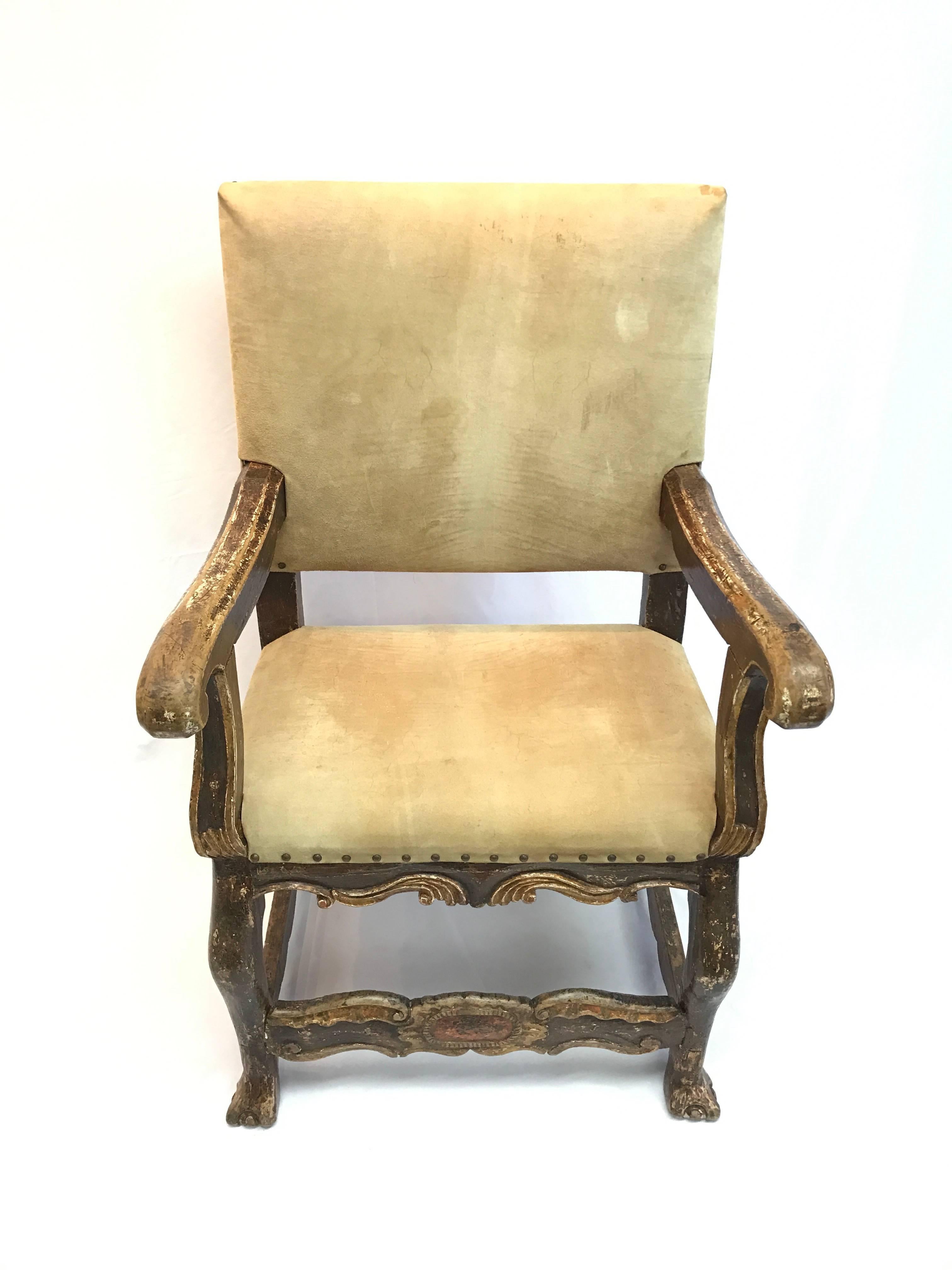 18th century Peruvian gold polychrome chair with suede upholstery and nail-head trim.