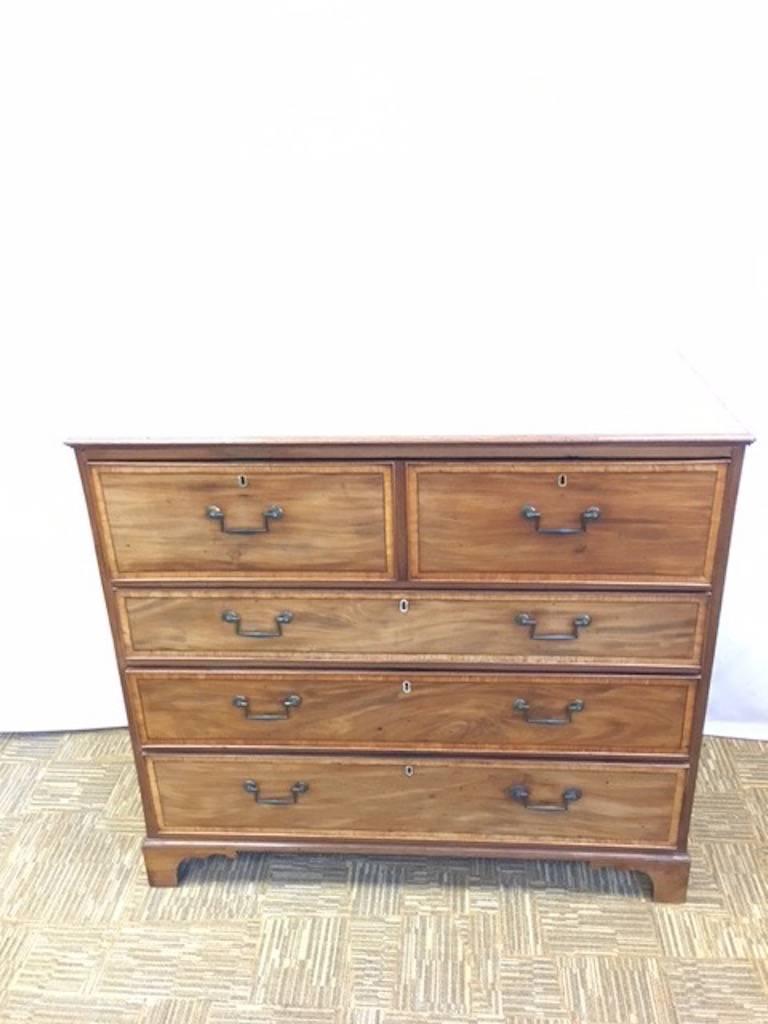 The two chests are drawers and one with a pullout desk unit.
The mahogany is inlaid with a lighter band framing the fronts of the drawers.
There is a leather writing surface which I feel has been added at a later time.
Everything is operable and