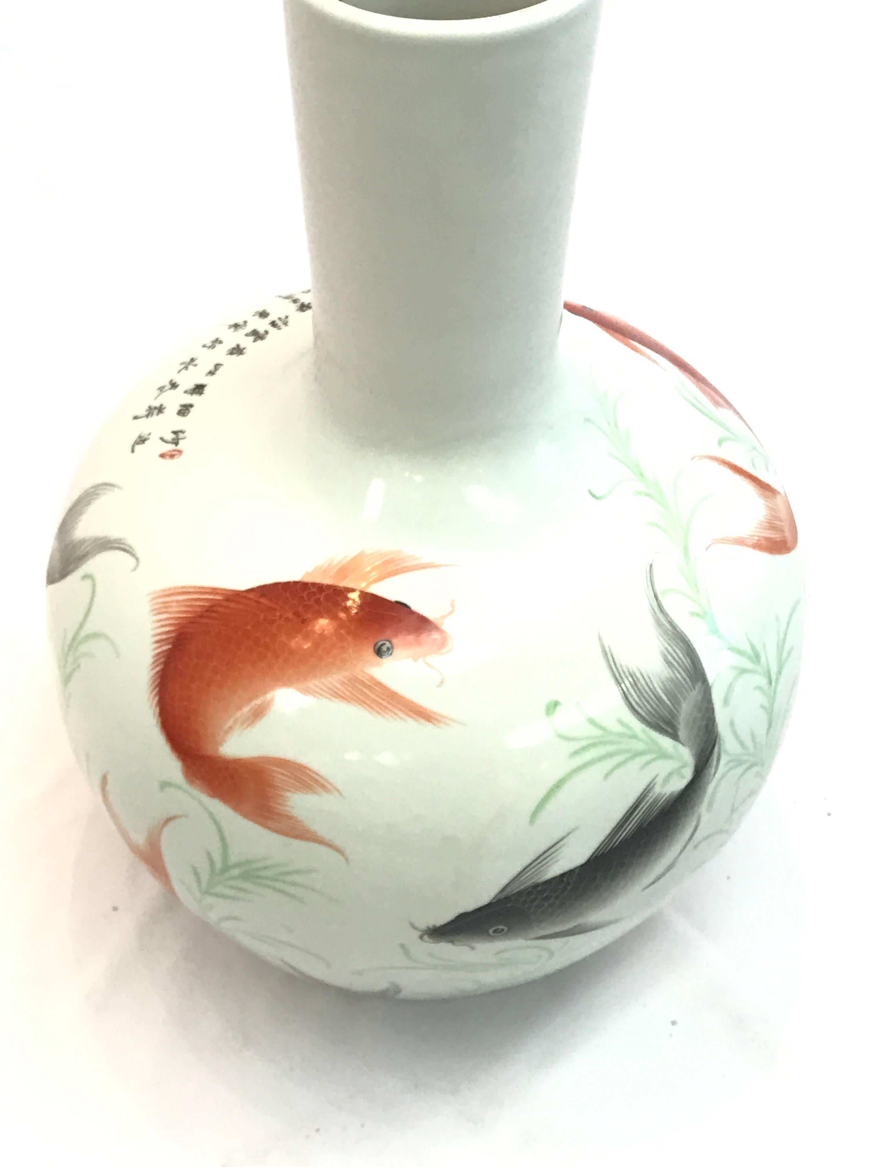 The oversized vase is surrounded by swimming koi. The piece is in perfect condition but with no provenance.

 