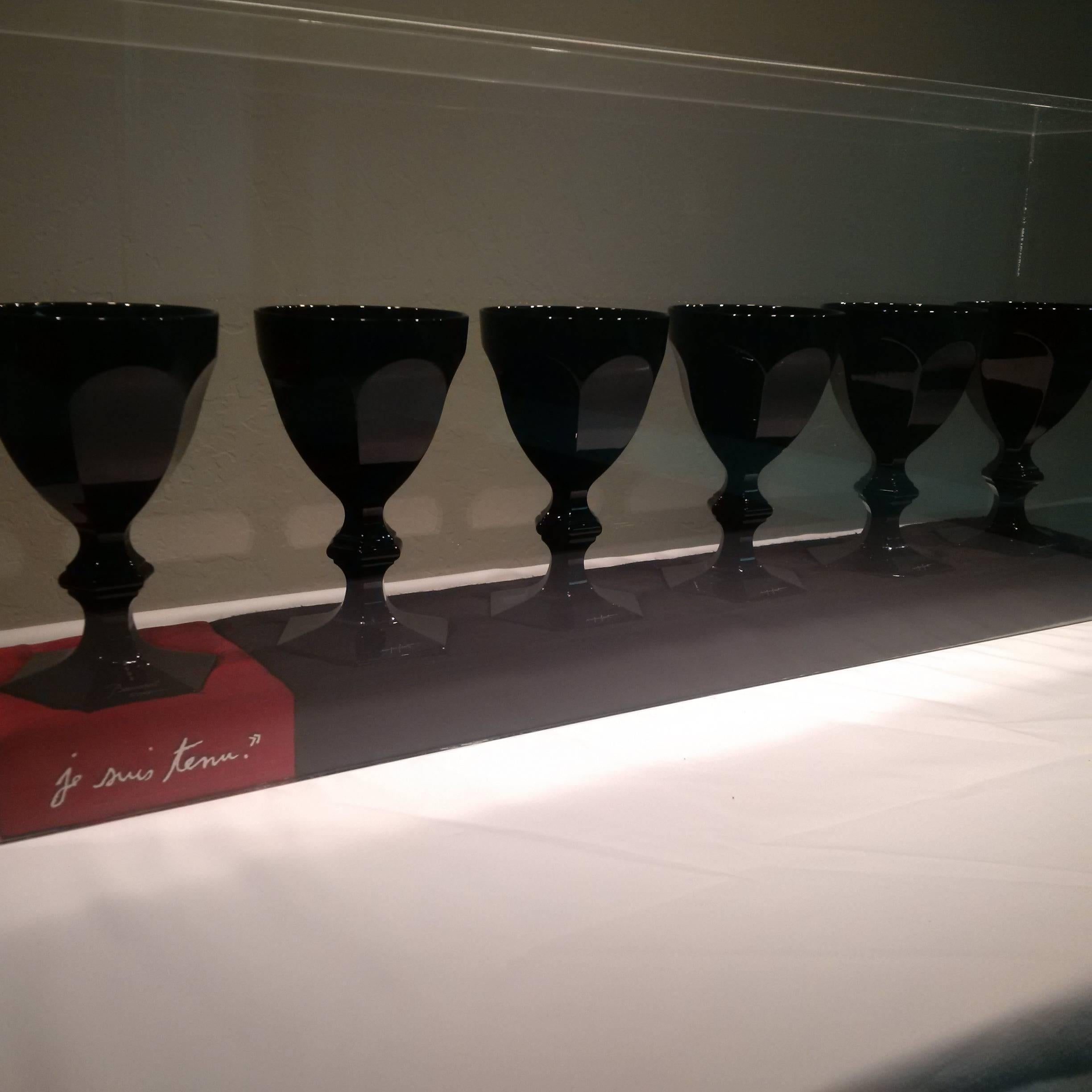 This showcase collection of signed and numbered wine glasses is Baccarat's presentation of Philippe Starck's interpretation of the Classic Harcourt wine glass in black crystal. All signed as well as the plexiglass case that covers all six fitted