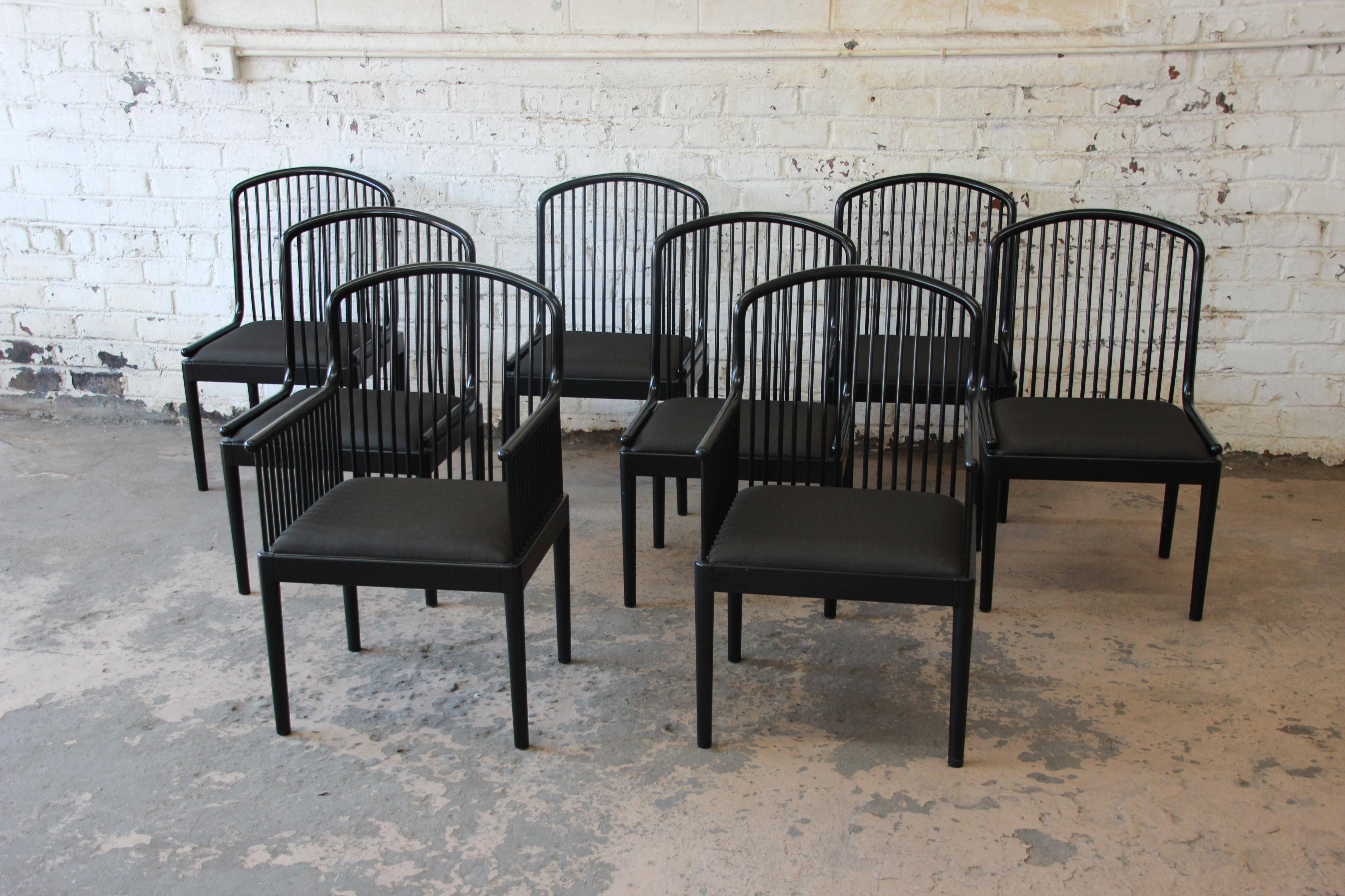 Offering an exceptional set of eight Andover black lacquered spindle dining chairs. The chairs were made in Italy by Stendig, circa 1985. The chairs feature a striking black lacquer finish and original charcoal gray upholstery. These chairs are a