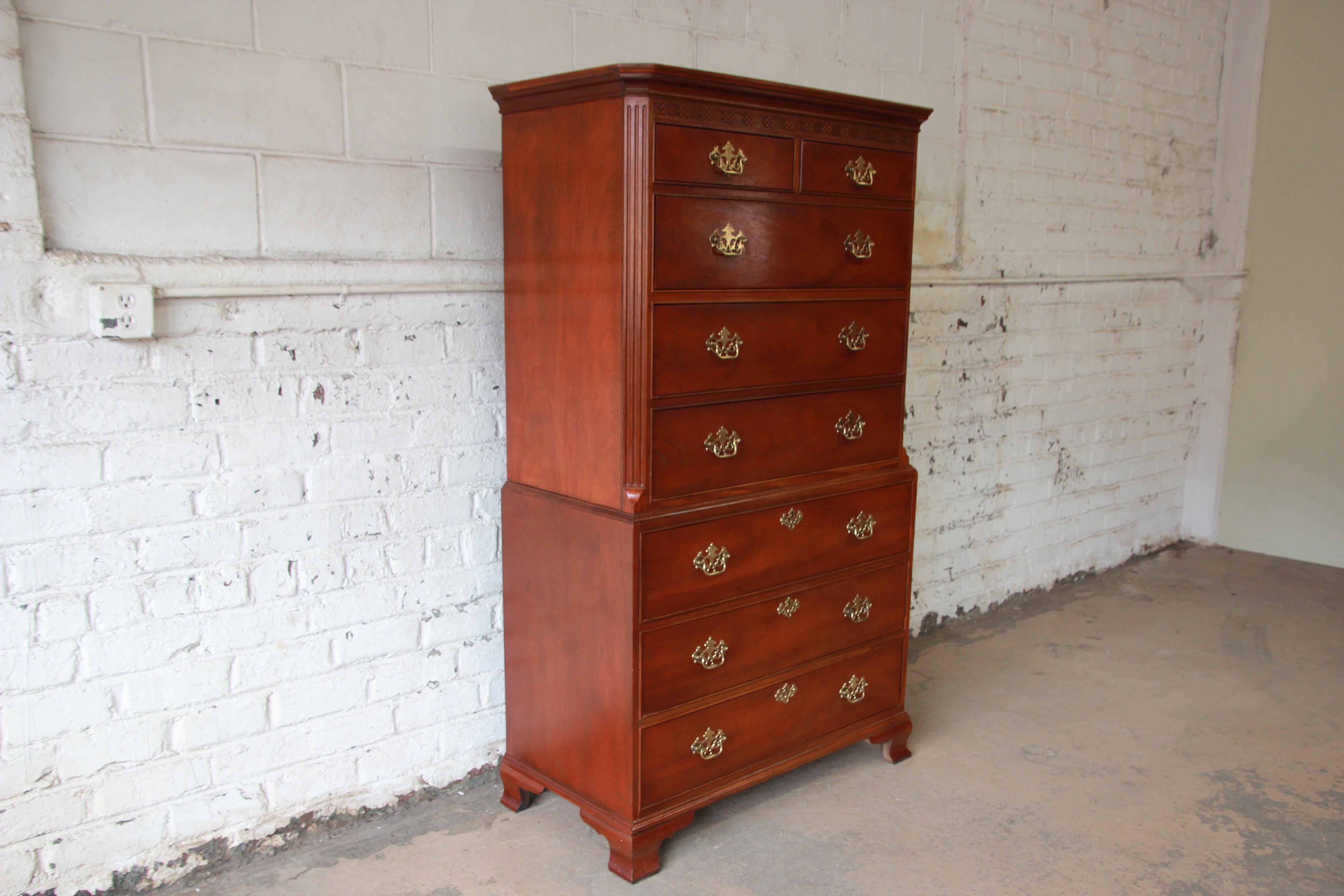 Chippendale style mahogany chest on chest dresser by Baker Furniture Company. The chest features gorgeous mahogany wood grain and a nice traditional style. It offers ample room for storage, with eight dovetailed drawers. The dresser is built from