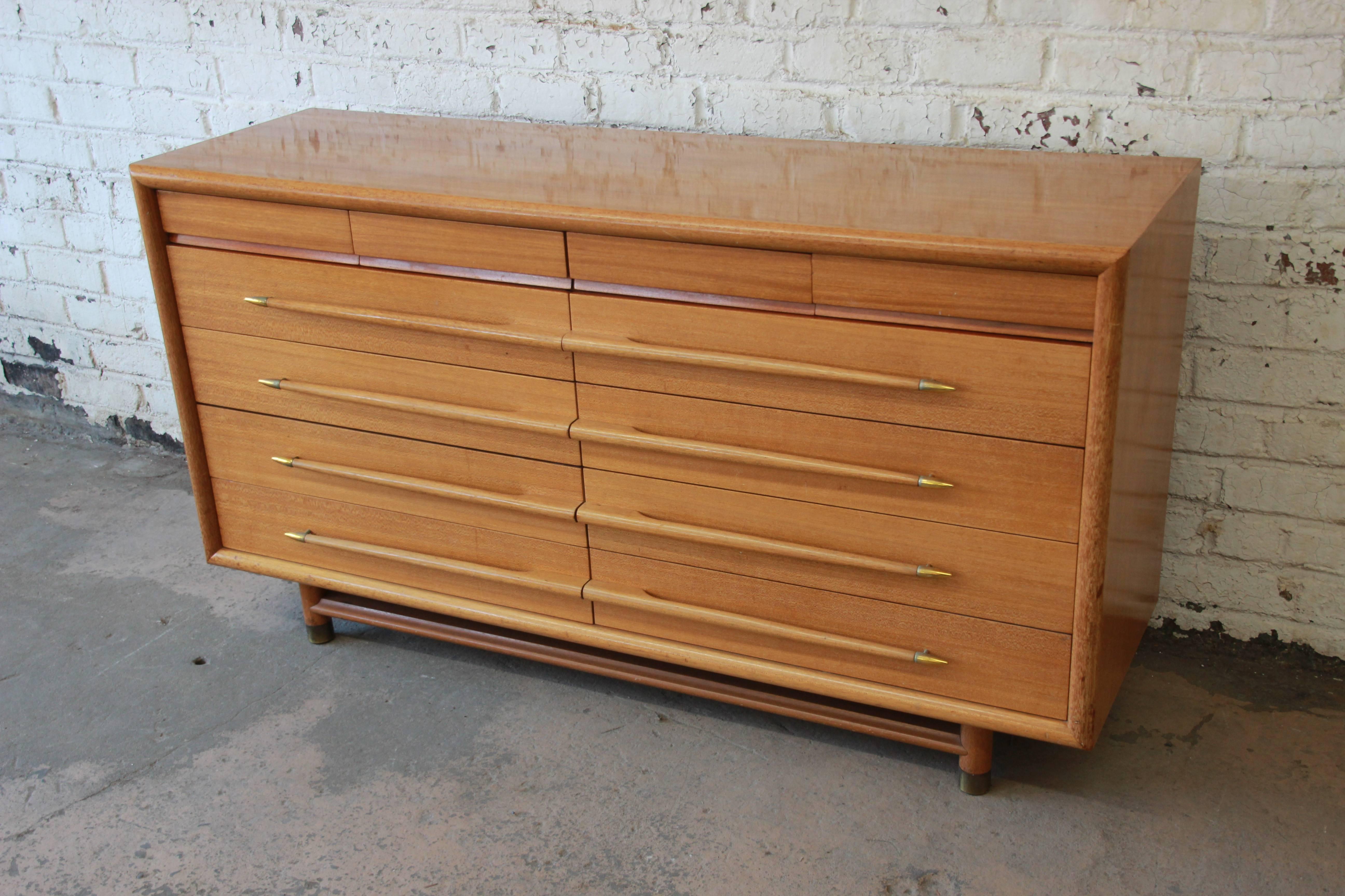Offering a rare and stylish Mid-Century Modern dresser by John Keal for Brown Saltman. The Mr. & Mrs. Dresser has four drawers at the top for great organization options. Below are four large drawers on each side that should suffice for both him and