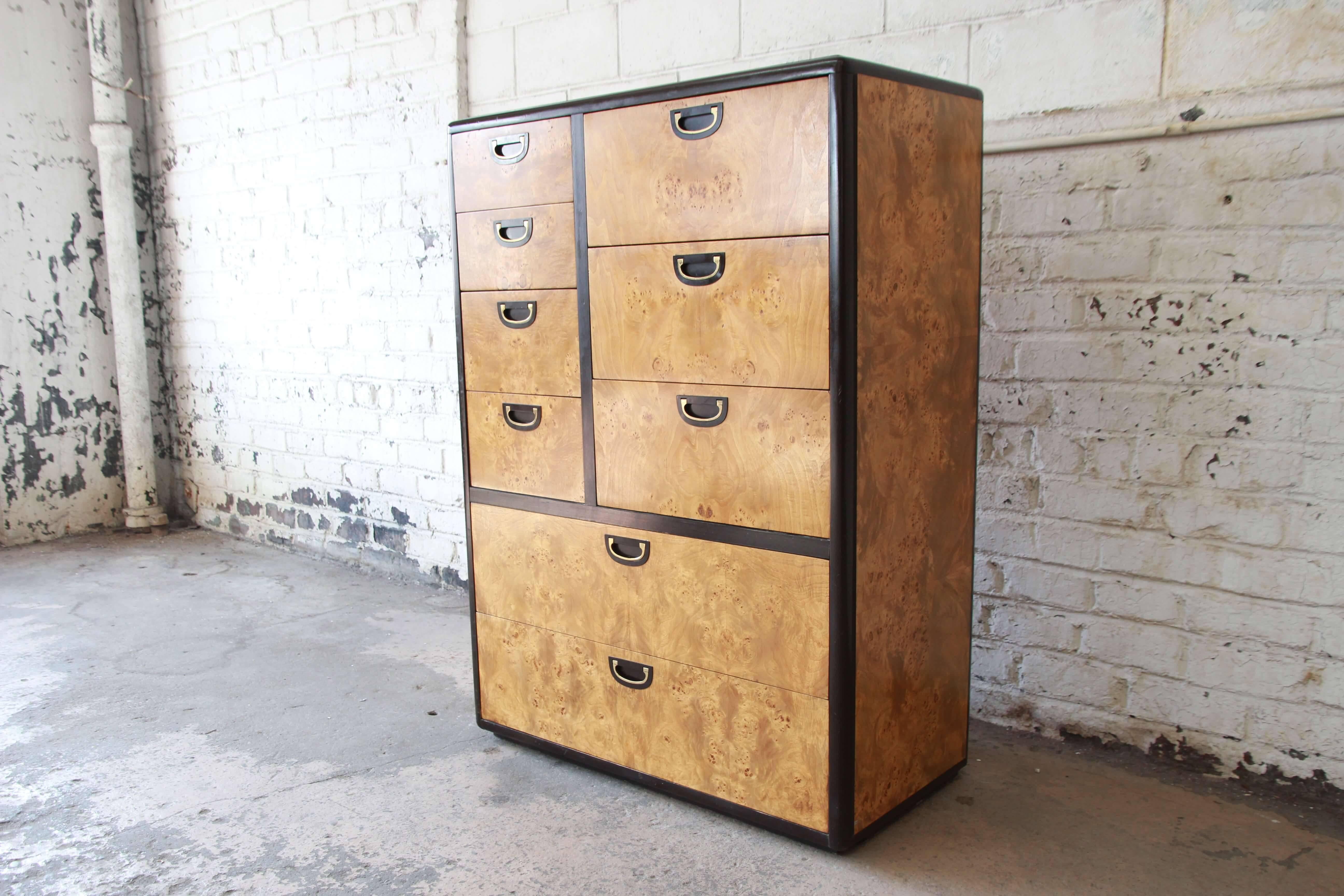 Offering a beautiful and rare nine-drawer burled olive wood chest by Lane Furniture. The chest has ample room for storage and organization featuring nice brass pulls and stunning burl wood finish. The gentlemen's chest is outlined in a dark brown