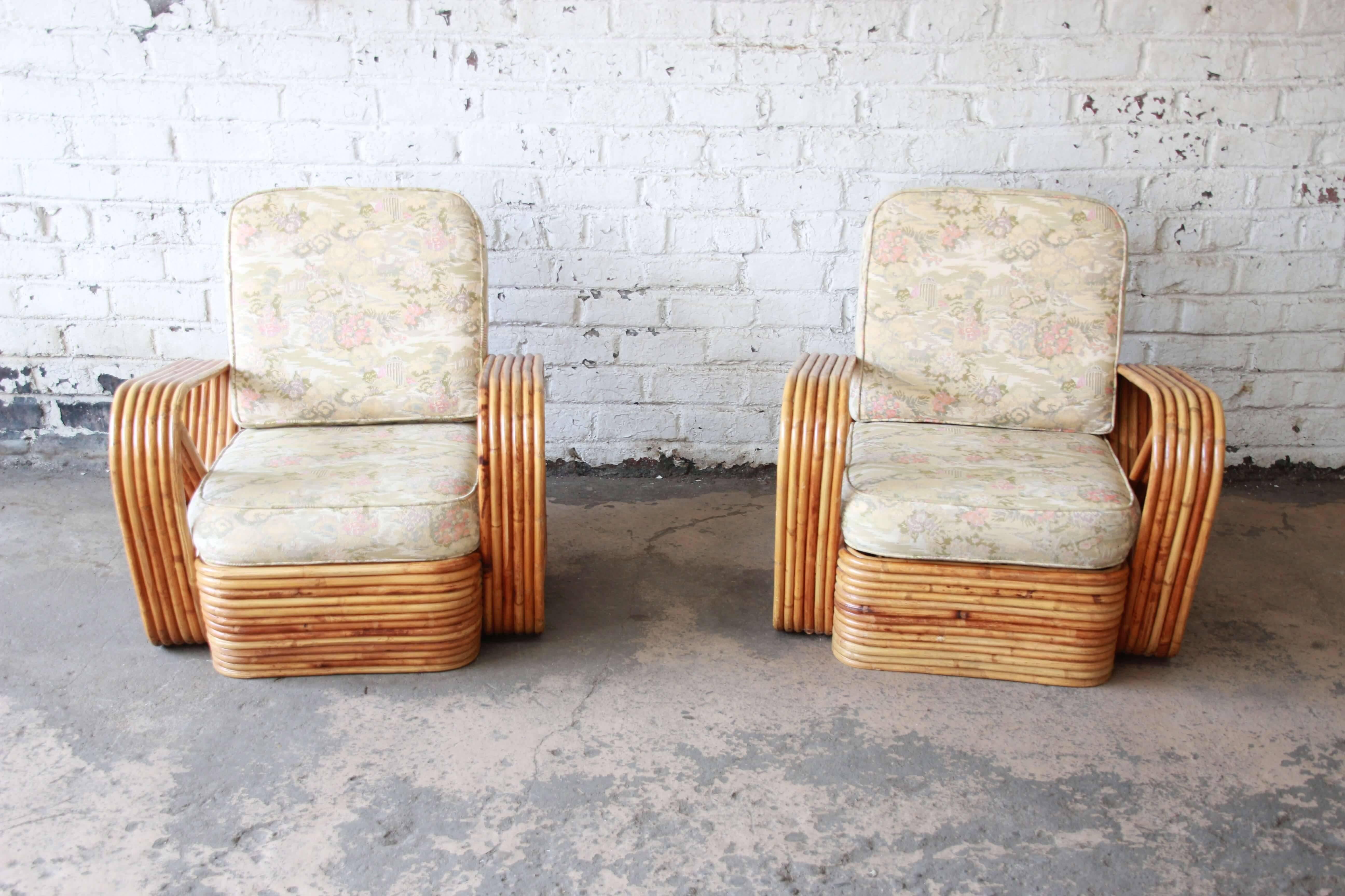 Offering a very nice pair of bamboo Pretzel chairs attributed to Paul Frankl. The chairs feature an unmistakable six-strand pretzel design. The rattan is in good condition with normal wear from age and use. The upholstery is clean with a floral