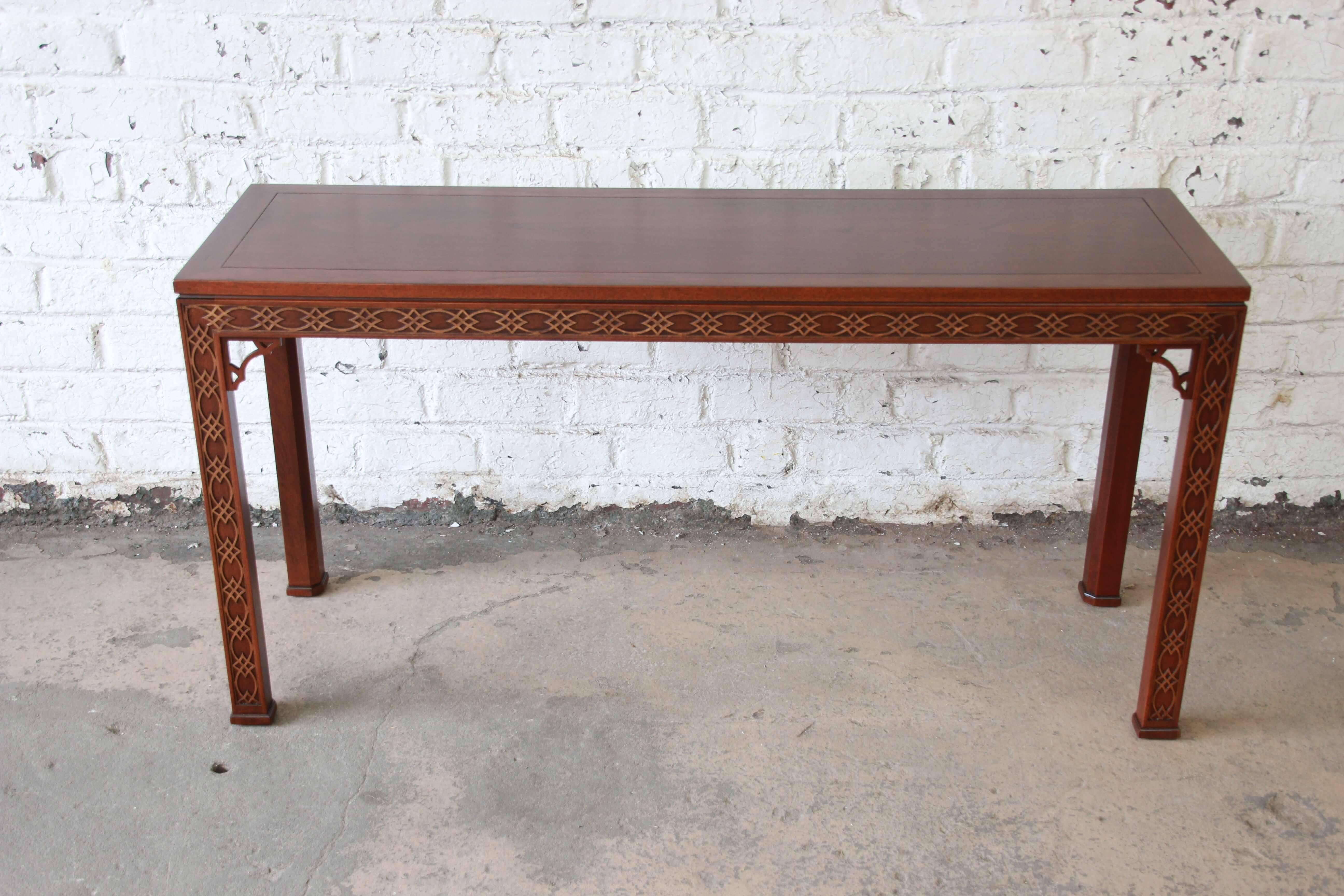 Offering a beautiful newly refinished carved mahogany Chinese Chippendale hall table by Kindel Furniture. This table has very nice carved details with a large surface to place display items of photos. It's a great size for a hall table, sofa table,