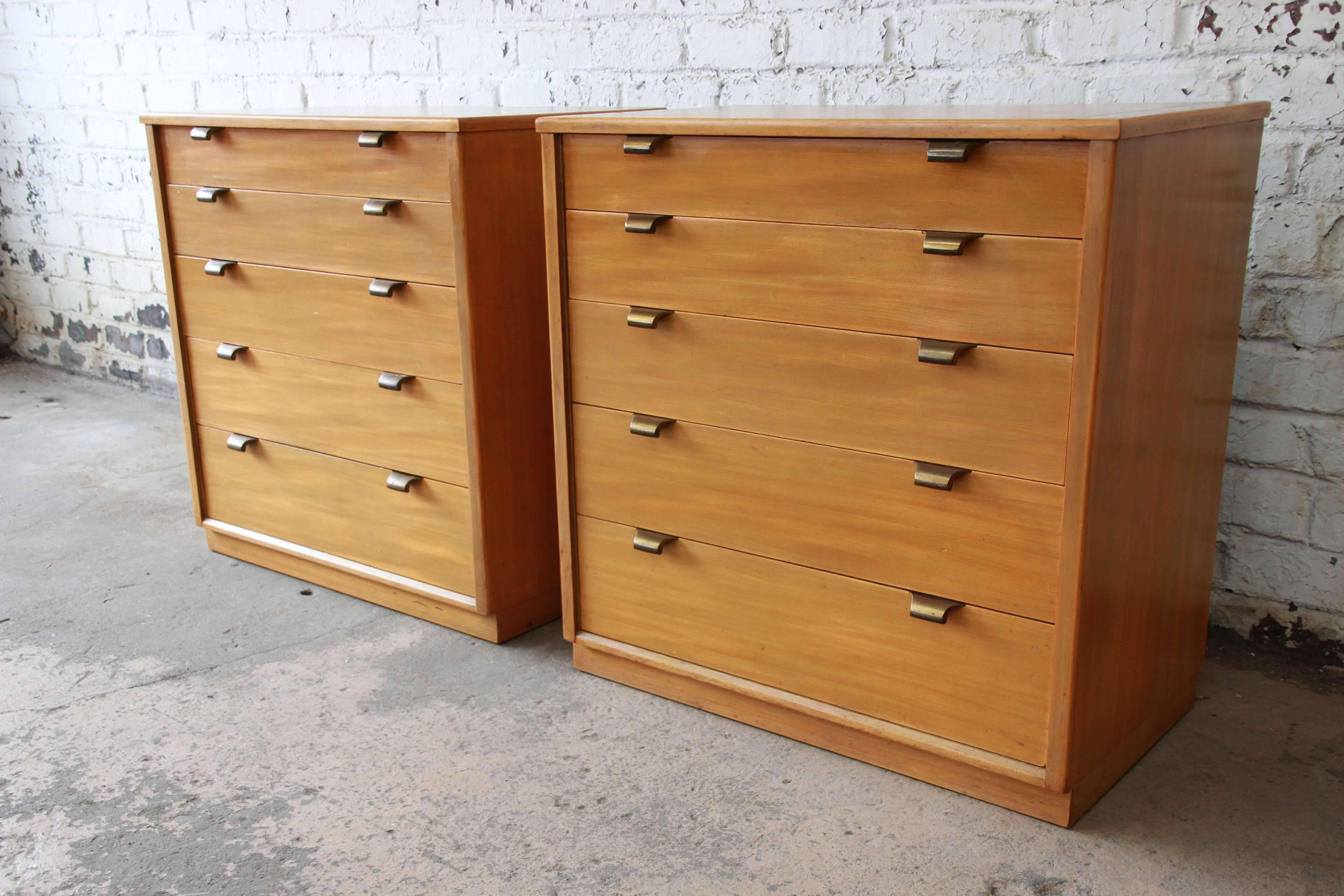 Offering a very nice and rare pair of Edward Wormley Precedent chests by Drexel. This pair can uniquely be a set of nightstands or chests offering five large drawers for ample storage. With brass pulls this pair offers clean Mid-Century Modern lines