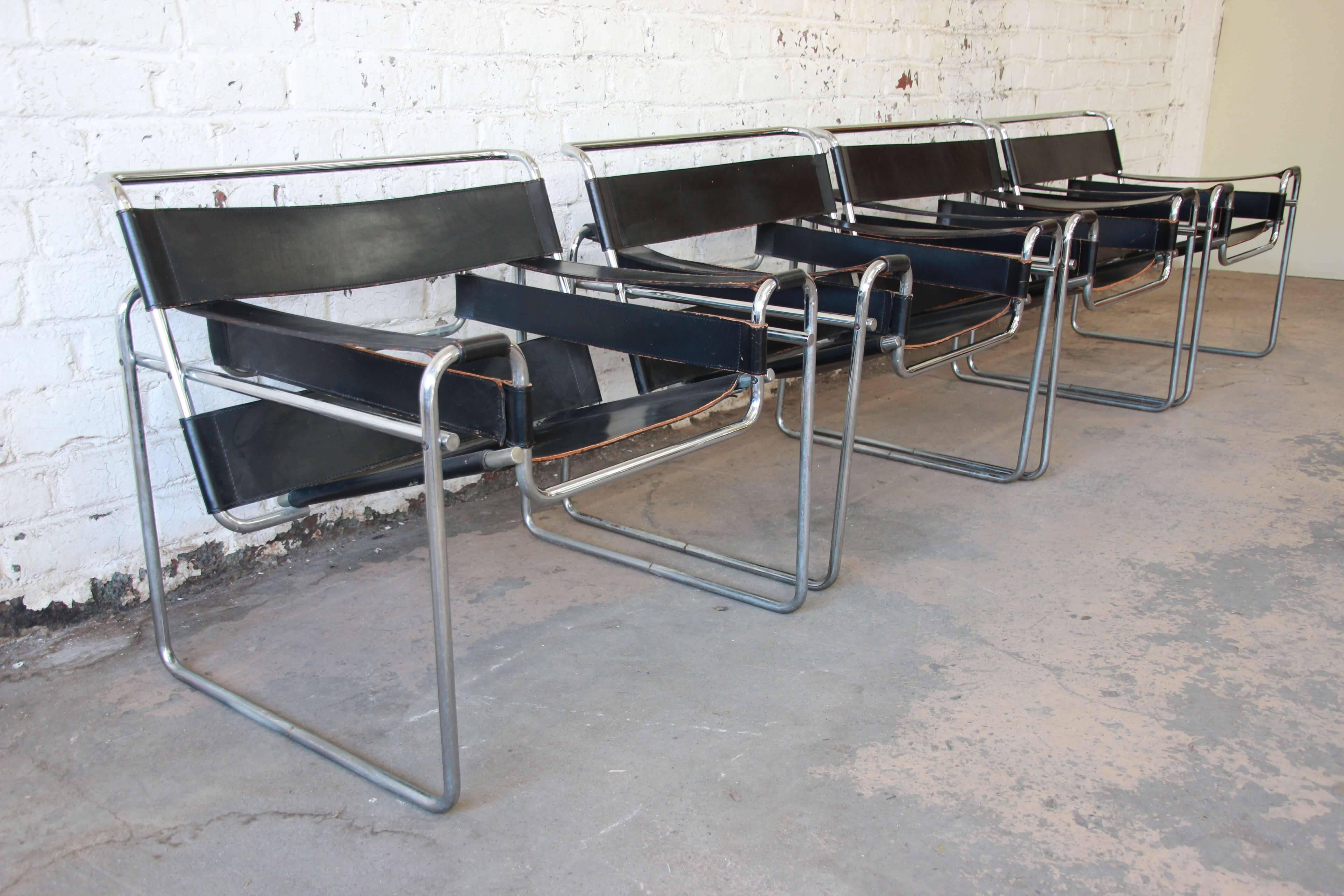 Offering black leather Wassily chairs by Marcel Breuer for Stendig. The chairs have a nice thick black leather seating armrest and backing. Each chair has a nice chrome tubular frame and all chairs are sturdy. Chairs are in good vintage condition
