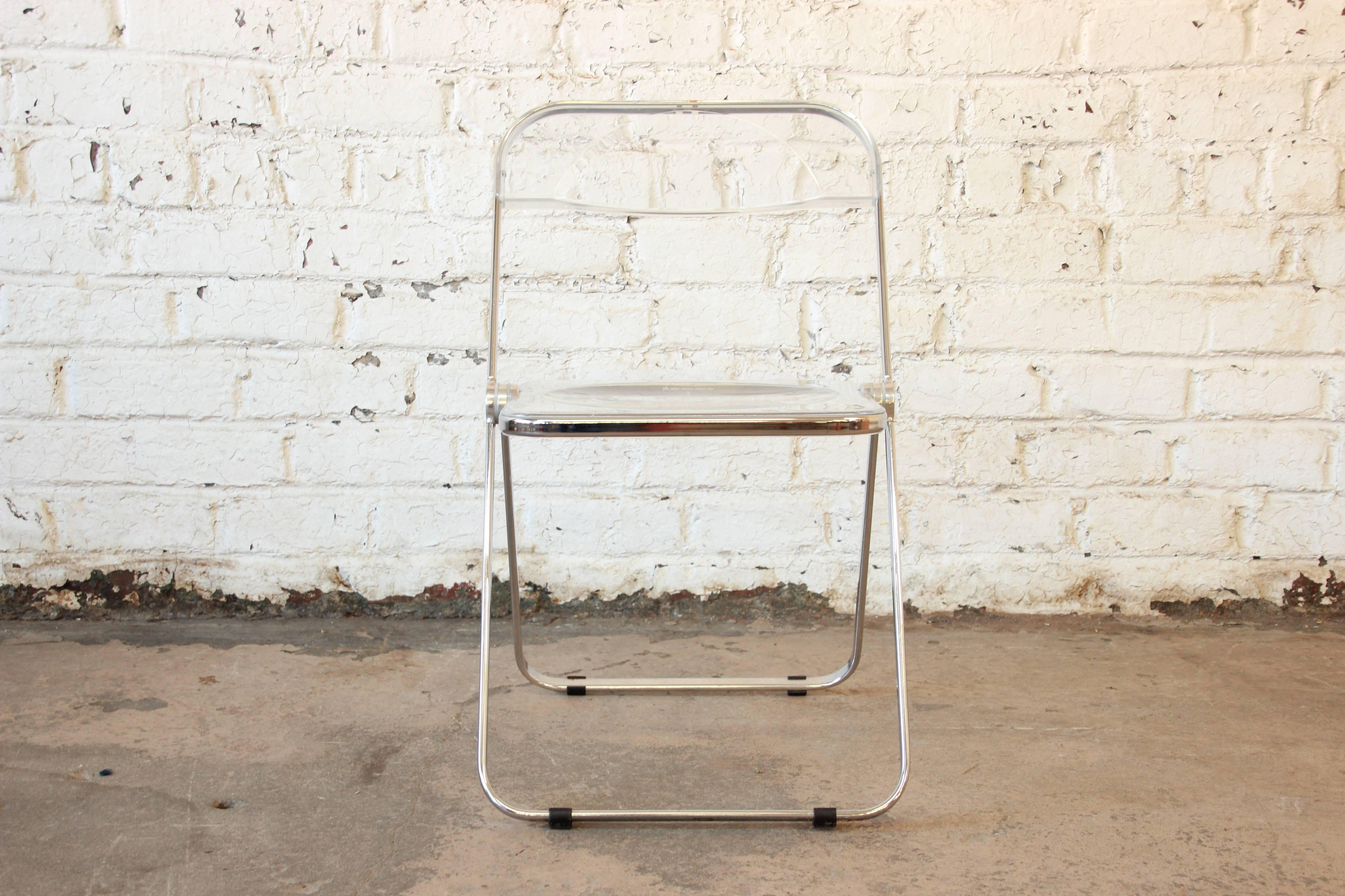 Offering a very nice midcentury Lucite folding chair by Giancarli Piretti for Castelli. The chair has nice Lucite seating back rest with a chrome frame. They are great for everyday or occasional use. Currently 14 available.
  