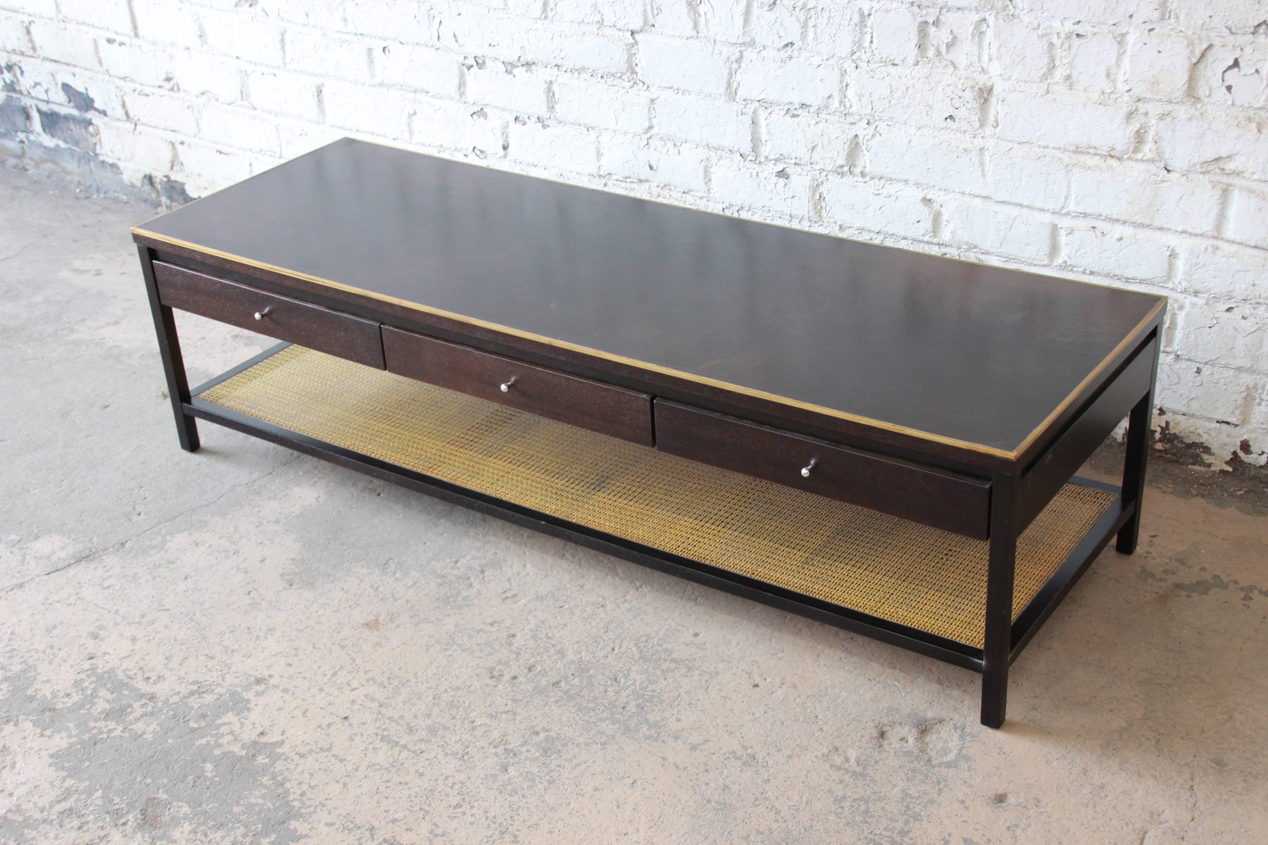 A rare and exceptional Mid-Century Modern two-tier coffee table designed by Paul McCobb for Calvin furniture's 