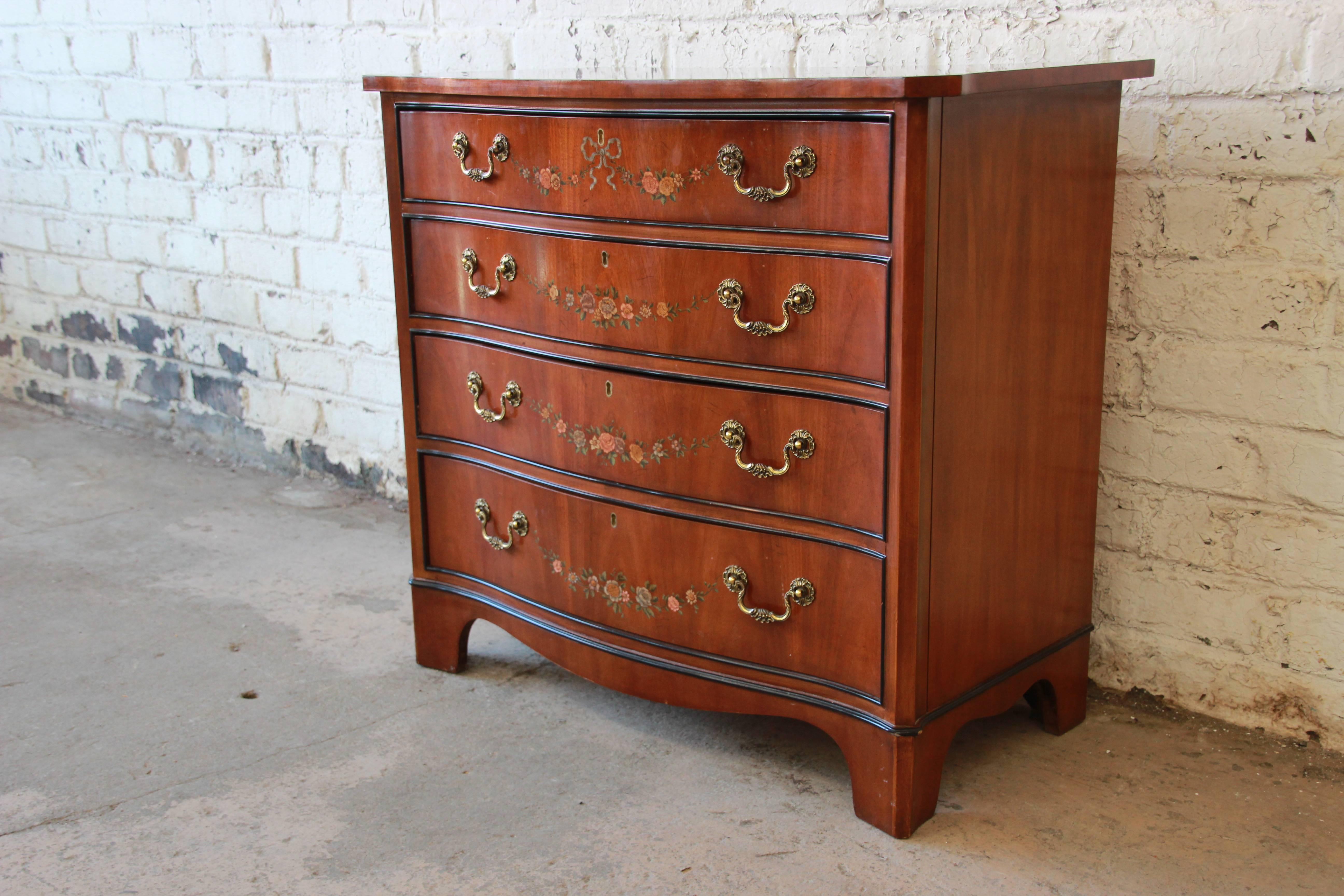 A very nice satinwood hand-painted Adam style chest of drawers or commode from the Devoncourt Collection by Drexel Heritage. The cabinet features gorgeous hand-painted floral details and beautiful satinwood grain. It has a nice traditional style and