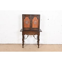 Baker Furniture Spanish Colonial Carved Oak Leather Front Bookcase, Circa 1900