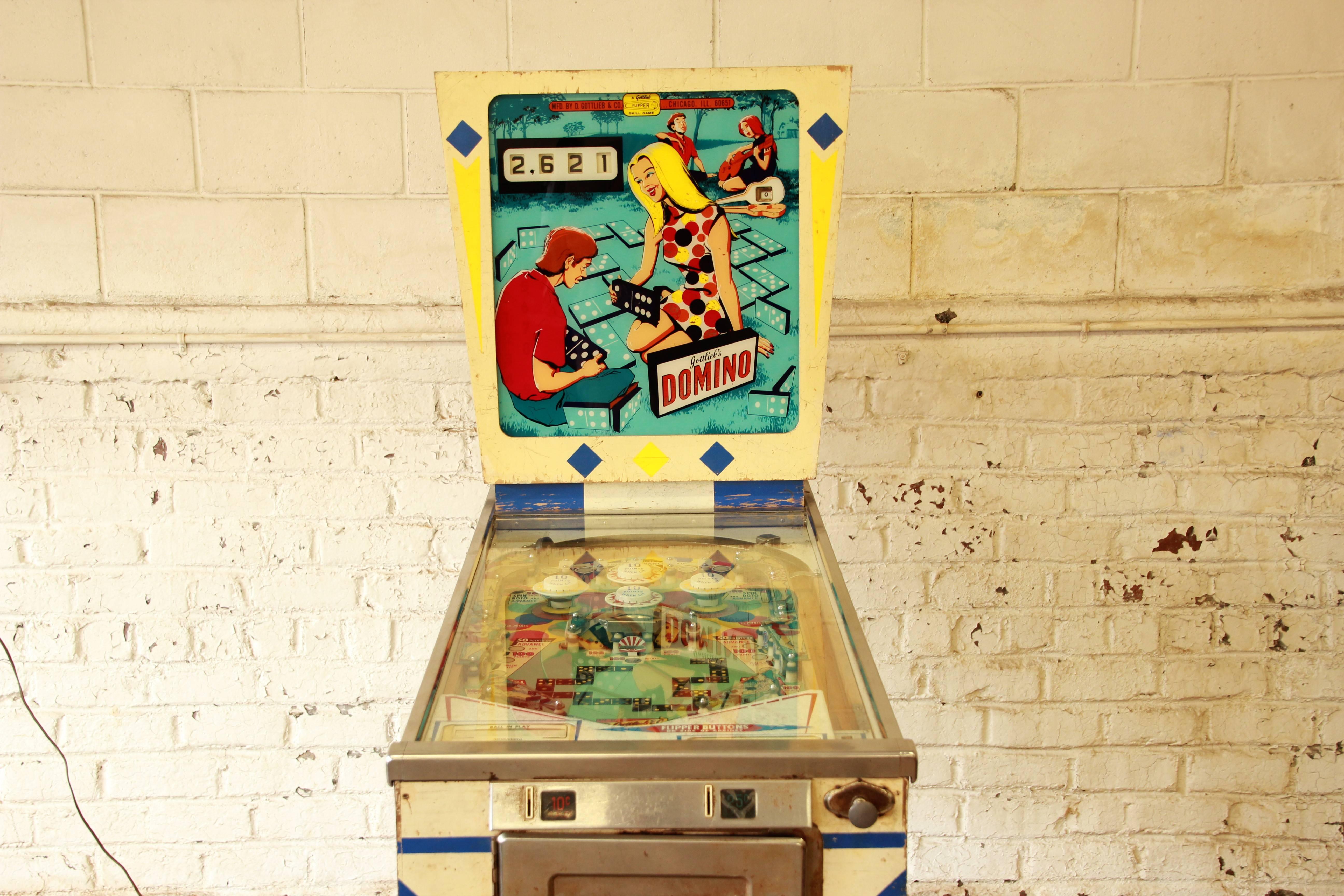 A unique original 1968 Gottlieb Domino pinball machine. The machine is in great working order with original components. All the lights work as well as all components. Some wear to the case that is consistent with age and use. Original flyer is