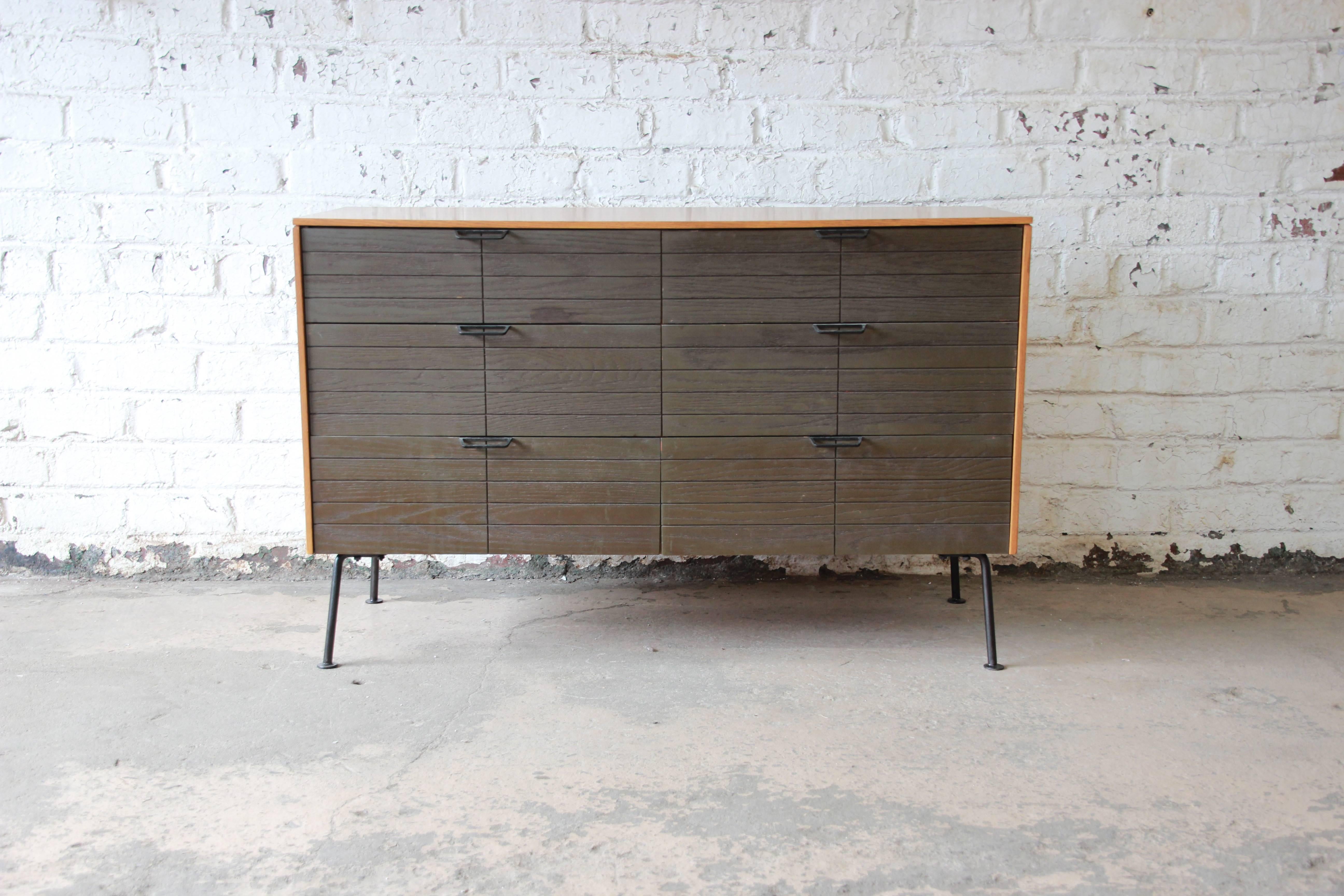 A rare and exceptional six-drawer Mid-Century Modern dresser designed by Raymond Loewy for Mengel Furniture Company. The dresser has a unique two-toned design. It offers ample room for storage with six deep dovetailed drawers. Metal pulls and legs