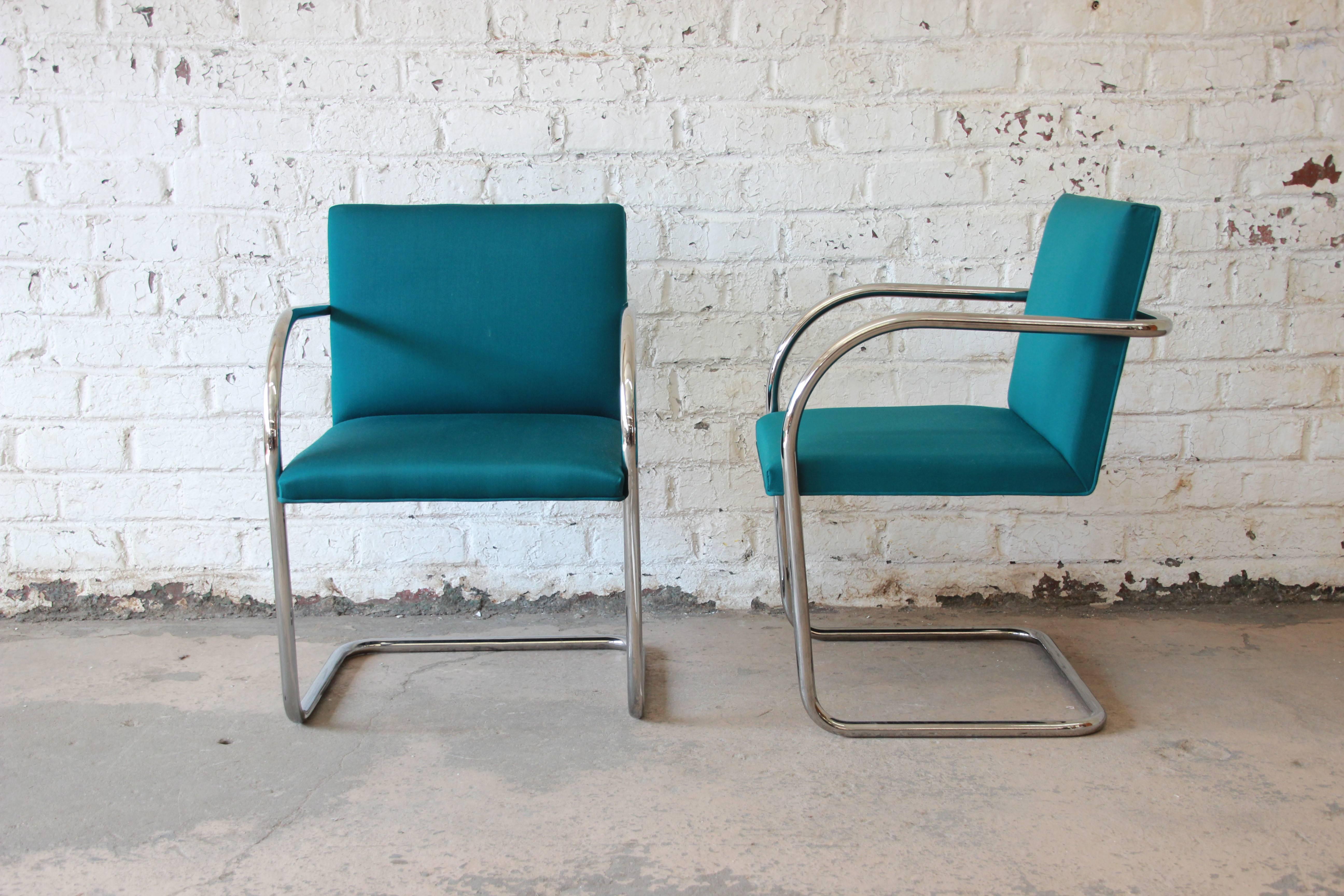 An excellent pair of Brno tubular chairs in pine green wool upholstery. Designed by Ludwig Mies van der Rohe in 1930 for the Tugendhat House. Chrome-plated steel frame. Signed label Knoll International. Measure: Arm height is 25.5