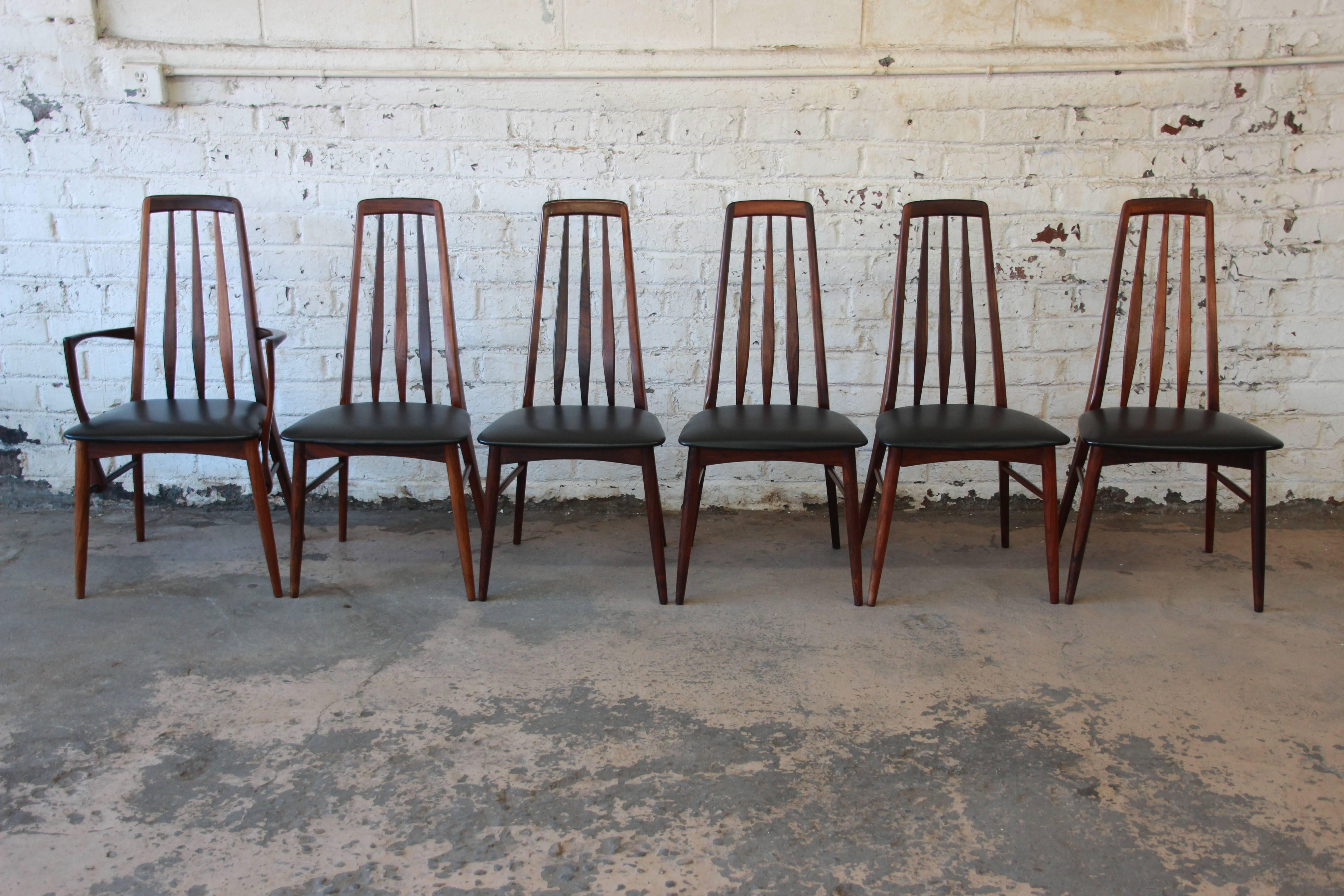 A gorgeous set of six rosewood 'Eva' dining chairs designed by Niels Koefoed for Koefoeds Hornslet, circa 1964. The chairs feature stunning solid rosewood frames with beautiful wood grain and sleek and stylish Mid-Century Danish Modern design. They