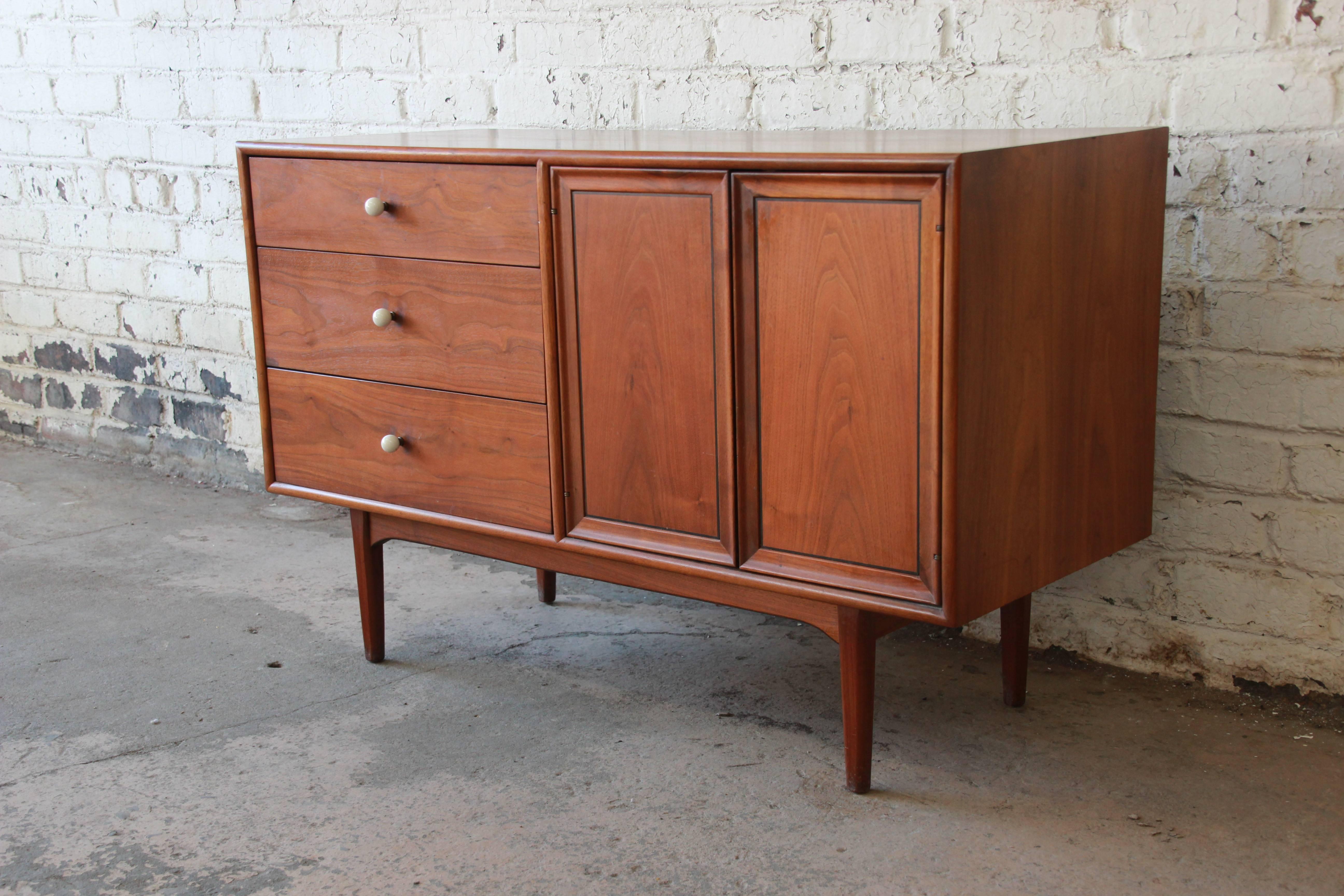 A very nice Mid-Century Modern walnut small sideboard or credenza designed by Kipp Stewart for Drexel's 