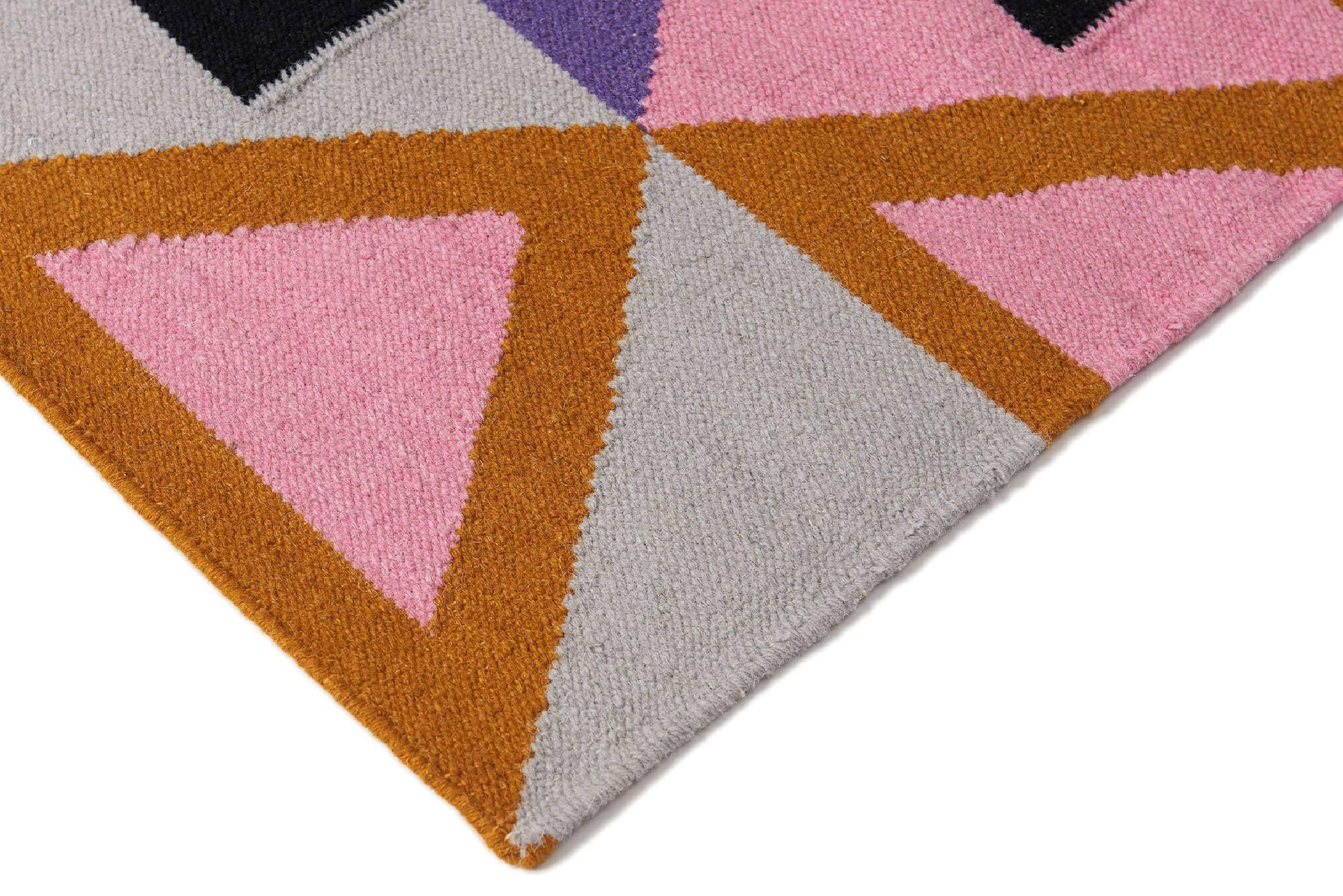 Modern, functional, sustainable. Make a statement with the Morgan design. It's is bold, colorful and unique. A geometric handwoven wool Dhurrie rug with a modern fresh approach. Designed by Aelfie.