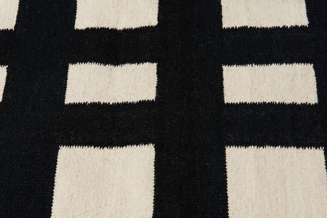 This listing is for an 8x10 rug. We are able to customize the size. Please reach out for more information on the customizations.  Aelfie rugs are designed in Brooklyn and handmade by artisans in India.

80% wool, 20% cotton.
Reversible.
Sizes are