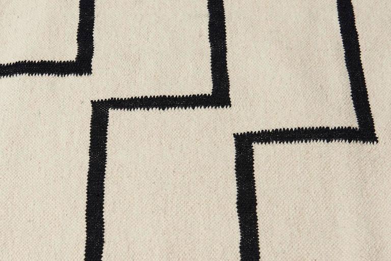 Modern, Functional, Sustainable. The tabitha design gives a fresh take on a Classic stripe. Geometric handwoven Dhurrie rug. Designed by Aelfie.