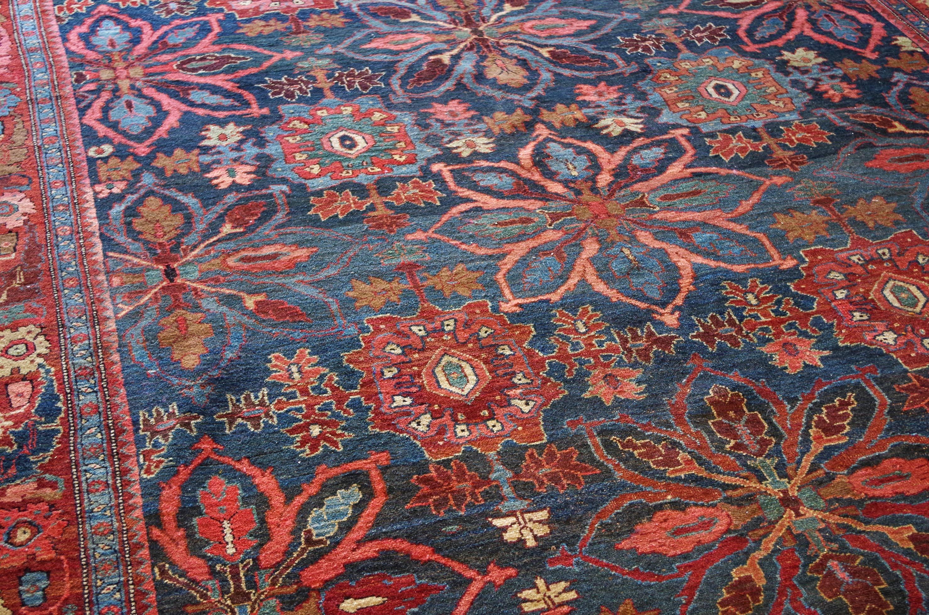 Large blossom and palmette design on a dark indigo field. North-West Persia, circa 1890. Woollen warp and weft, woollen pile. Very good condition.