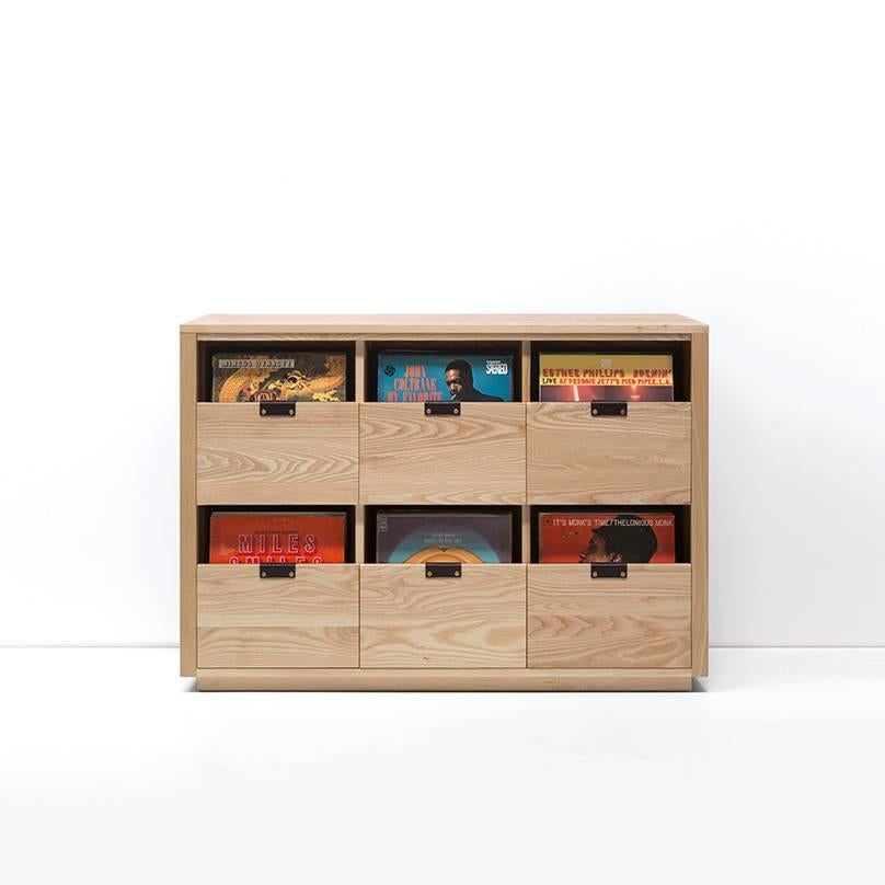 Our dovetail vinyl storage cabinets utilize a “file drawer” approach to store LPs and allow you to easily flip through an entire record collection while enjoying a visual display of record cover art across the front of the cabinet. The design