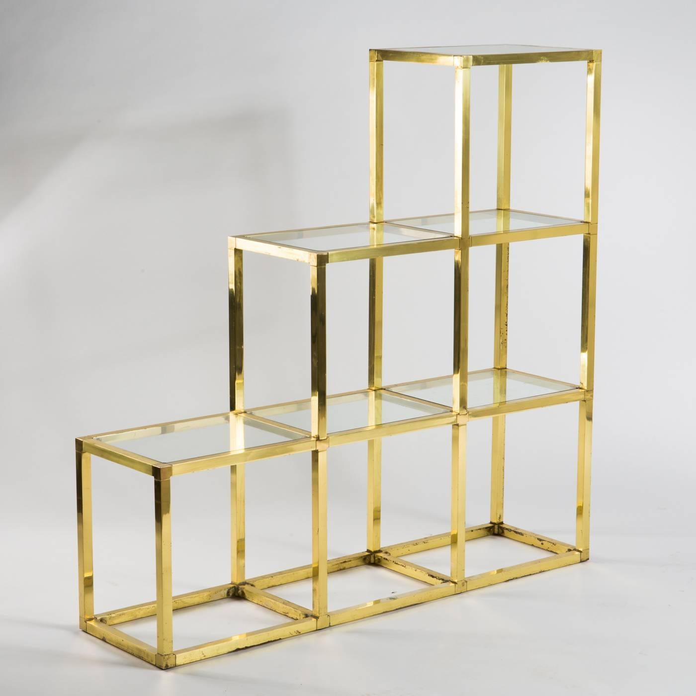 Vintage brass and glass shelving system in Art Deco style designed by Italian Romeo Rega in 1970s.