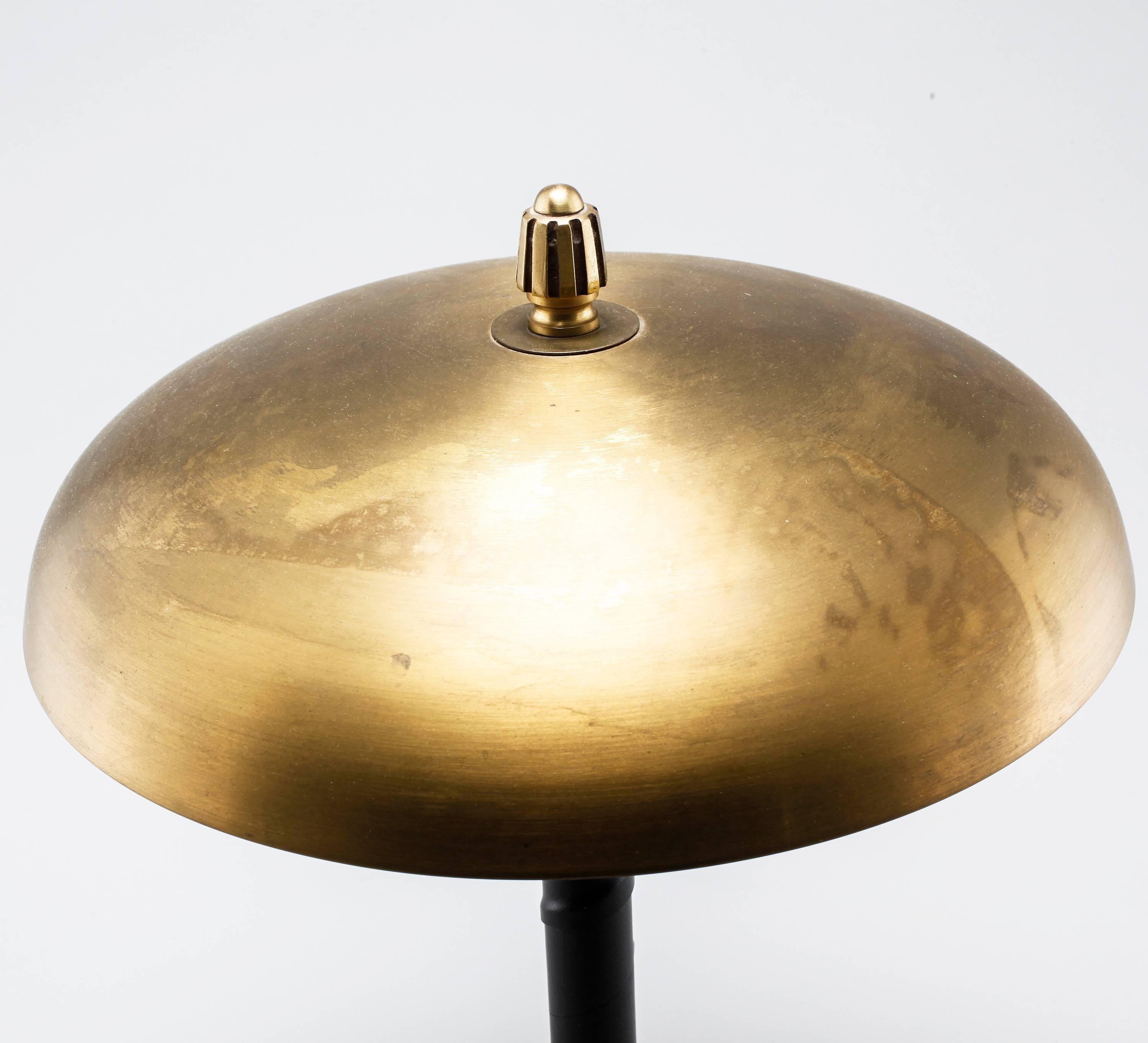 Swedish table lamp made in brass and black leather wrapped stem. Designed and manufactured by Einar Backstrom in 1940s.