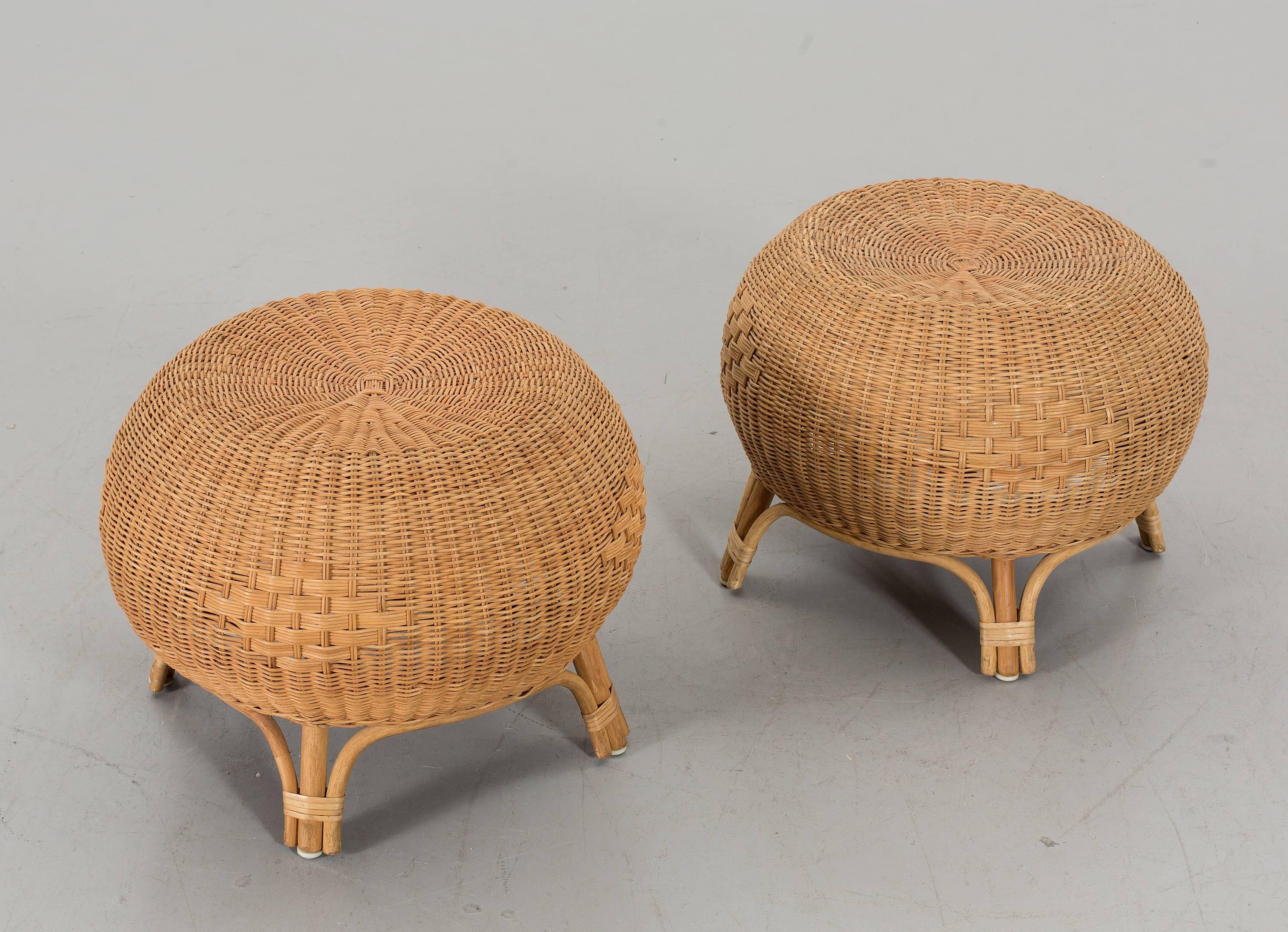 Pair of mid-20th century Scandinavian rounded ottomans or side tables made in bamboo and rattan.