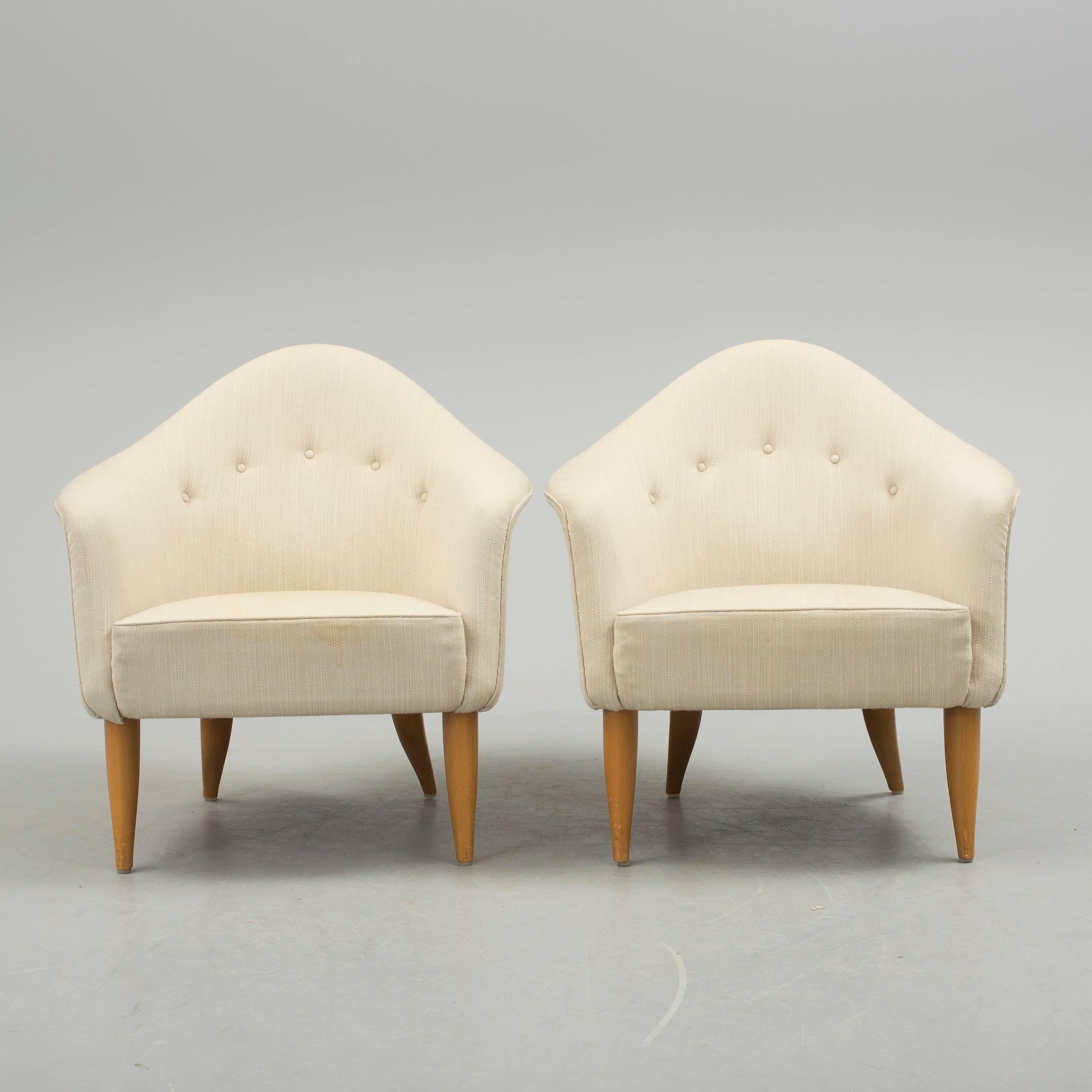 Pair of 'Little Adam' lounge chairs designed by n for Nordiska Kompaniet, in Sweden 1958. Original white wool upholstered.