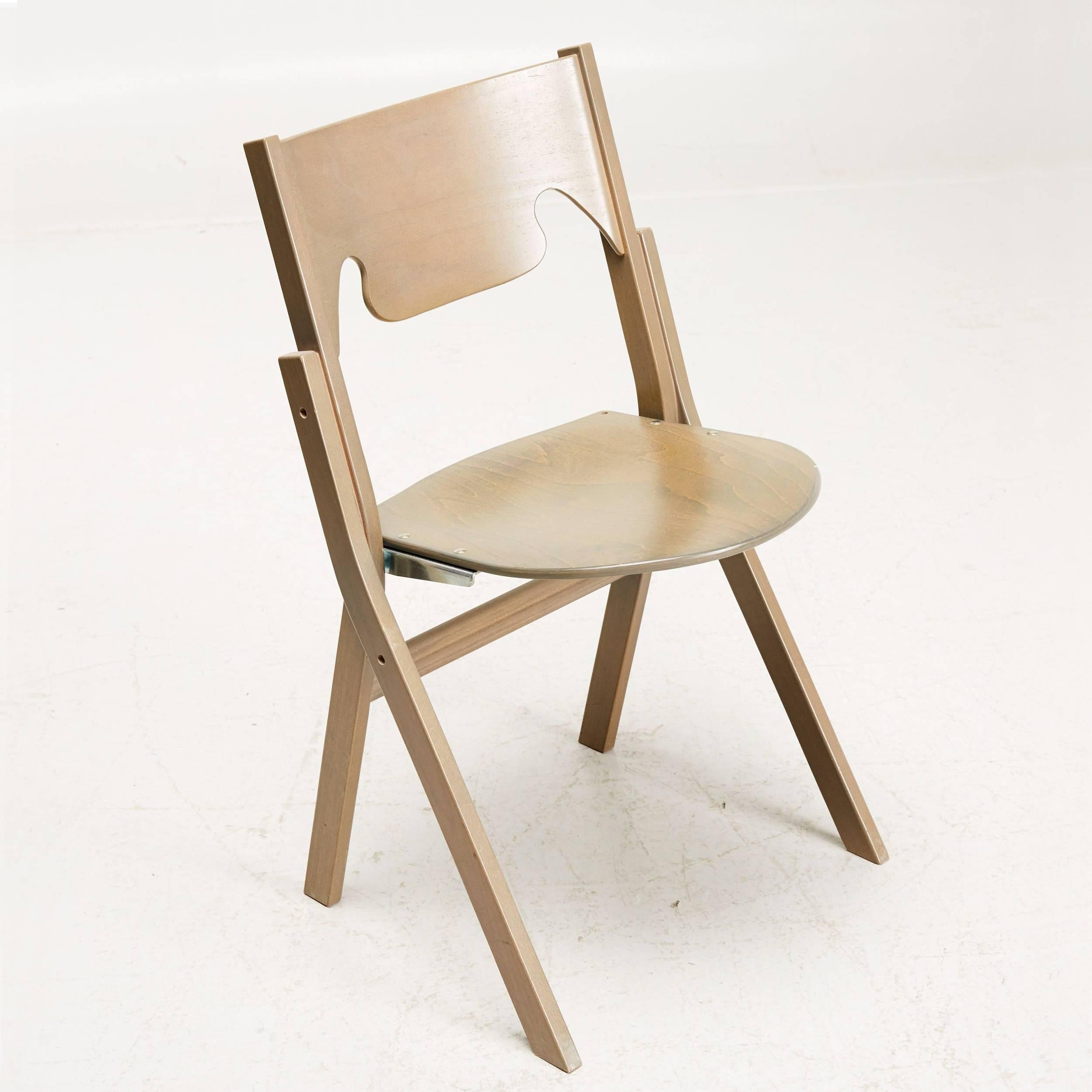 Set of 24 Scandinavian Postmodern folding chairs designed and produced by Swedish architect Ake Axelsson, made in solid birchwood.
Transport trolley included.
 