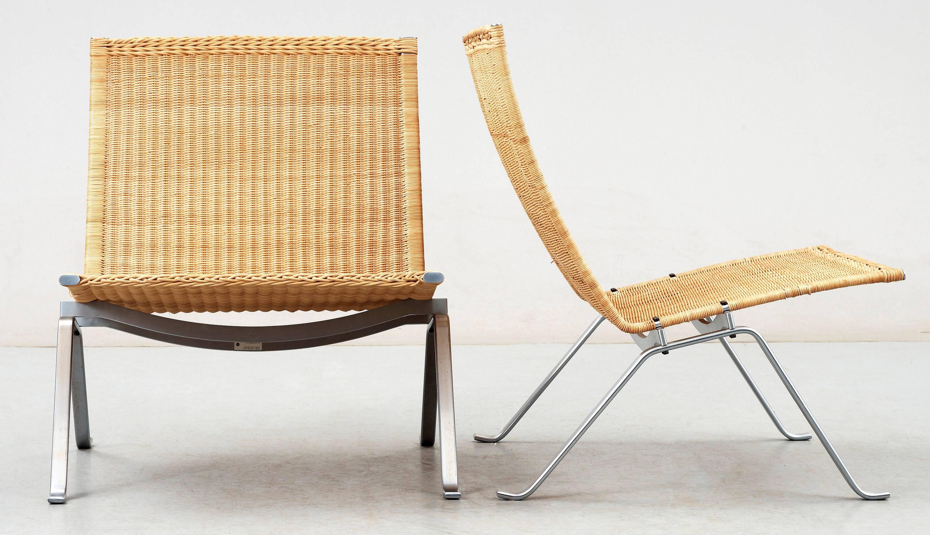 Pair of cane easy chairs model PK-22 designed by Poul Kjaerholm. One produced by E. Kold Christensen and one by Fritz Hansen in Denmark.