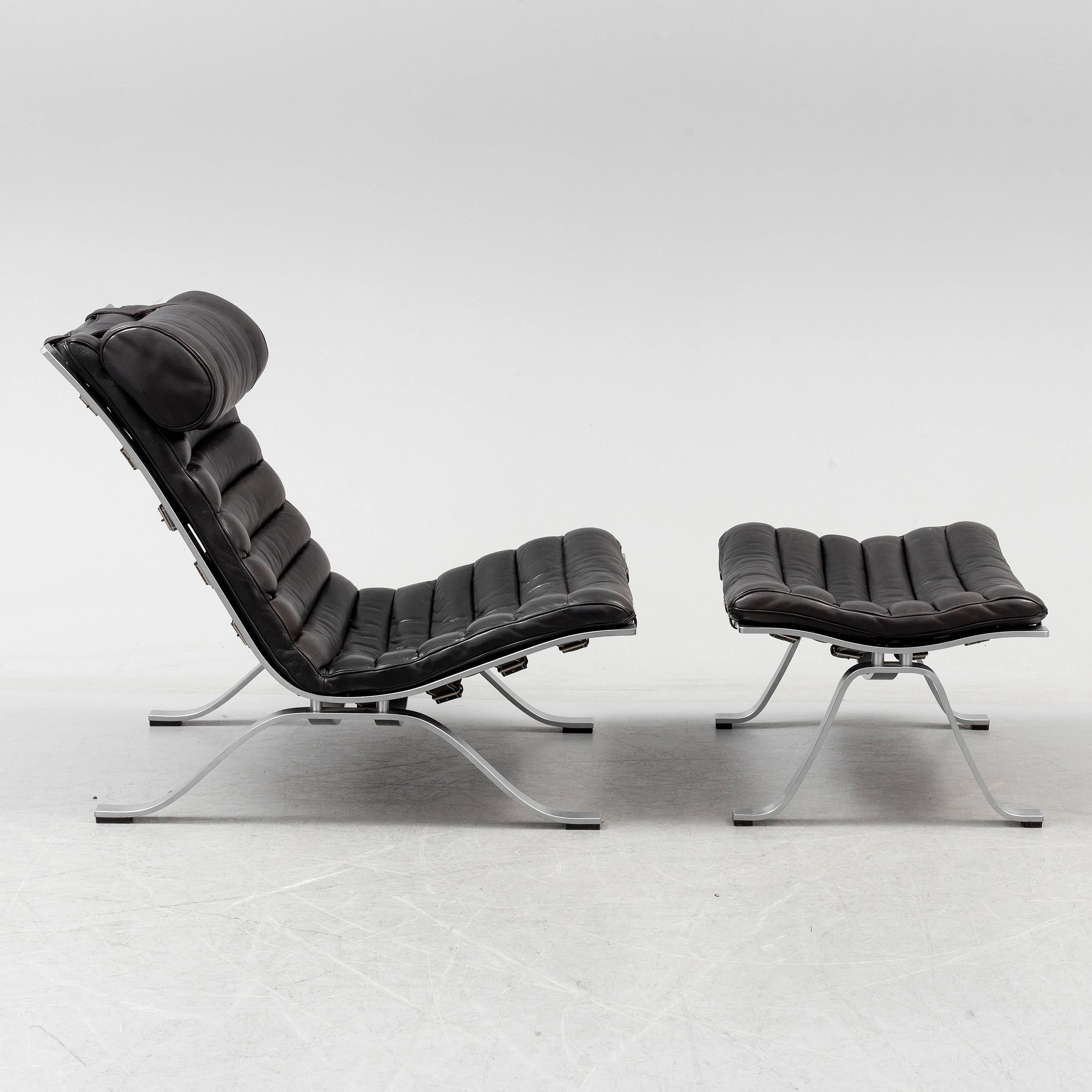 Lounge chair and ottoman model Ari in black leather, designed in 1966 by Arne Norell. Produced by Arne Norell Mobel in, Sweden.