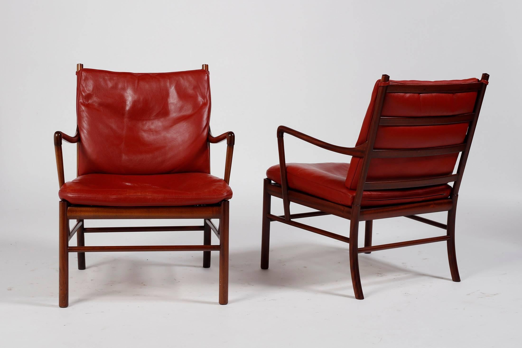 Solid mahogany armchairs with woven cane seats and red aniline leather cushions, designed by Ole Wanscher for Poul Jeppesens Mobelfabrik Edition. Model PJ-49 manufactured in Denmark in 1959.