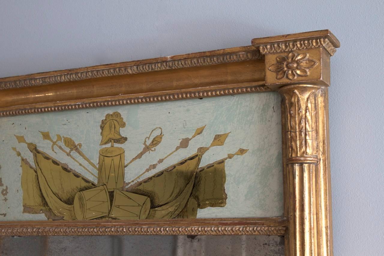 A superb surviving example of a very rare mirror, the hand-painted Verre églomisé panel commemorative of G Washington. The original mirror plate remains as does the original water gilded surface.
