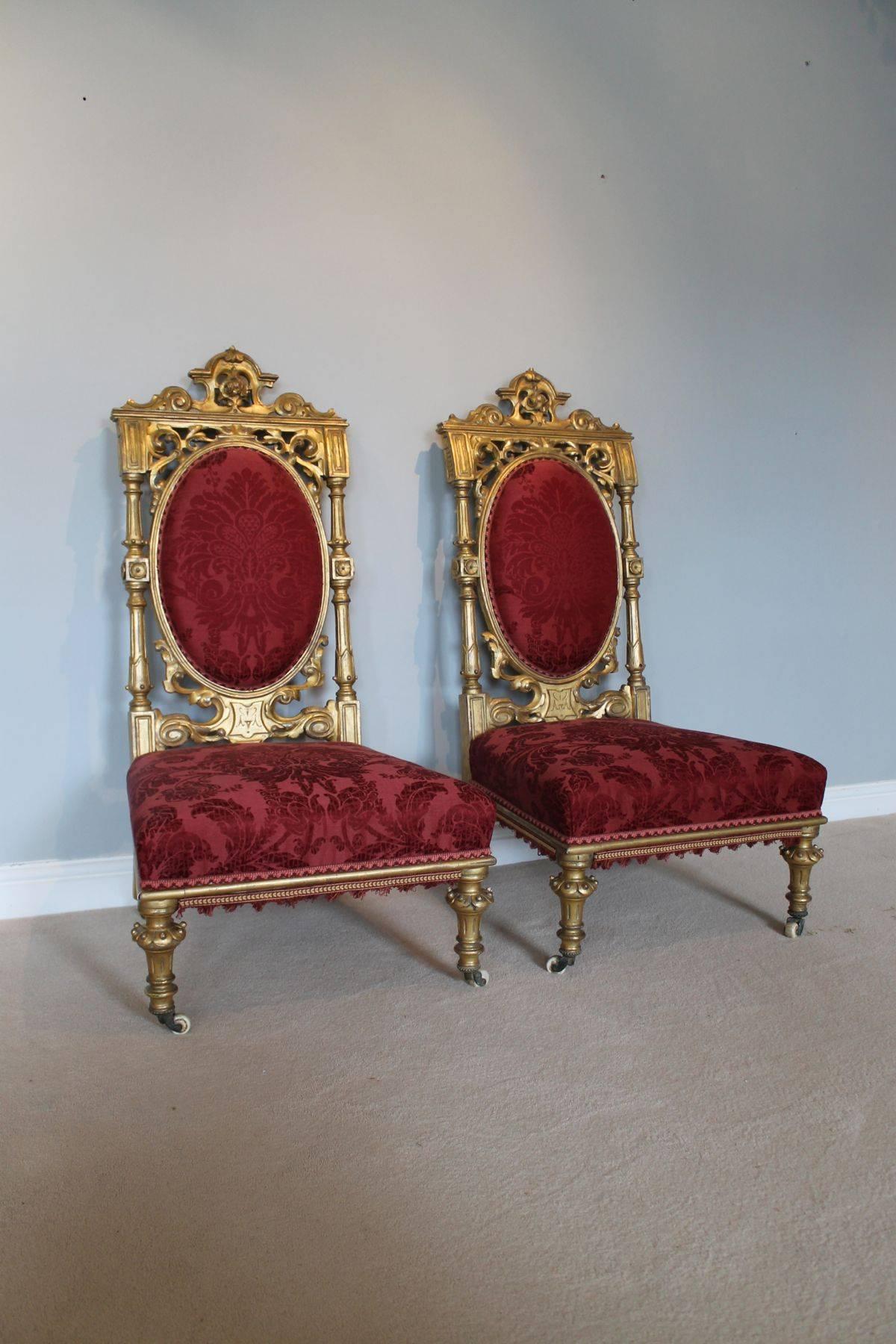 A very stylish and useful pair of English, late 19 century Aesthetic Movement chairs. The original gilding has a wonderful mellow, evenly worn appearance, with wear commensurate with the age of the item. Very useable and perfect for a hallway or